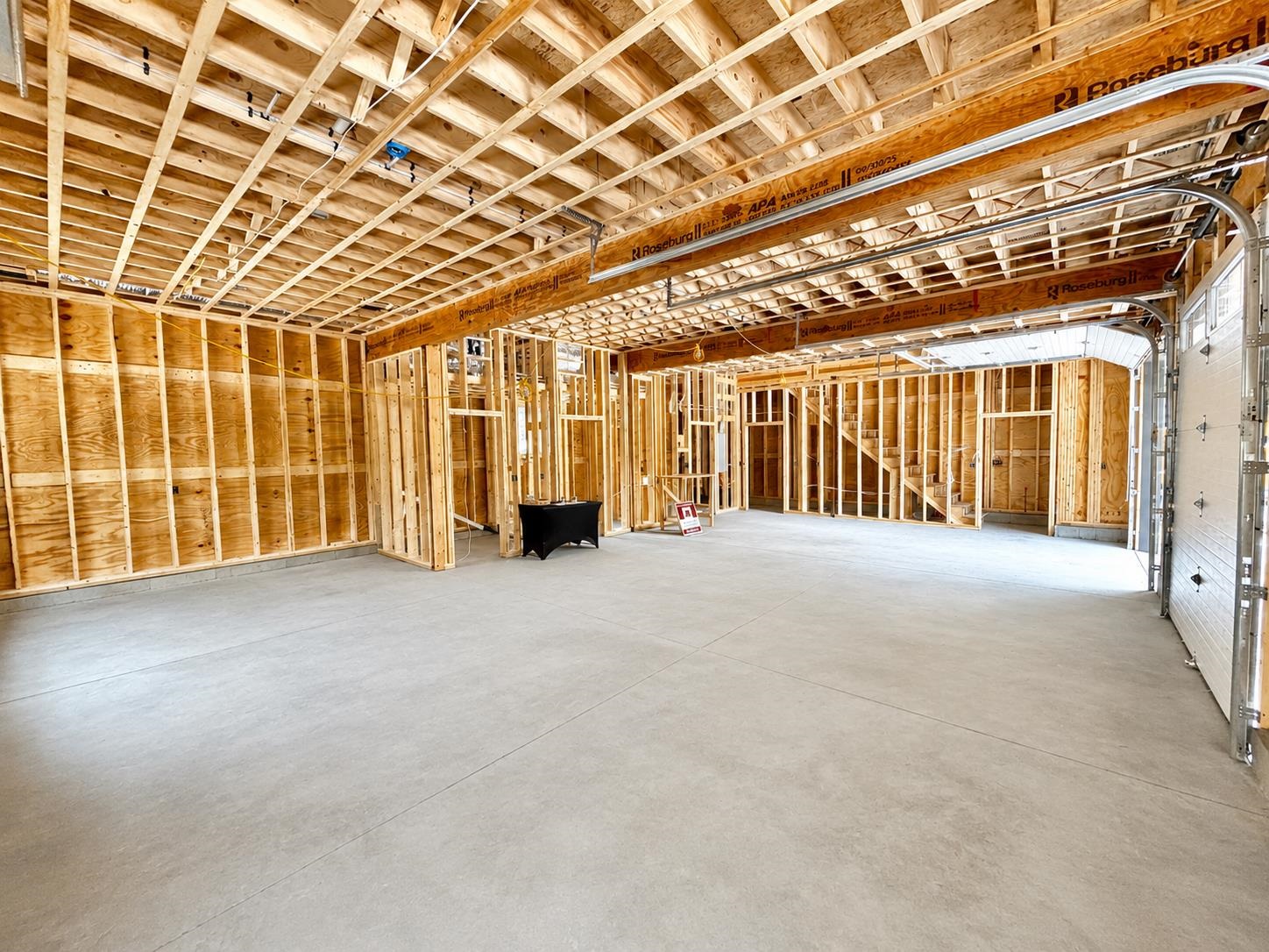 3 bay garage with 1/2 bath and closets