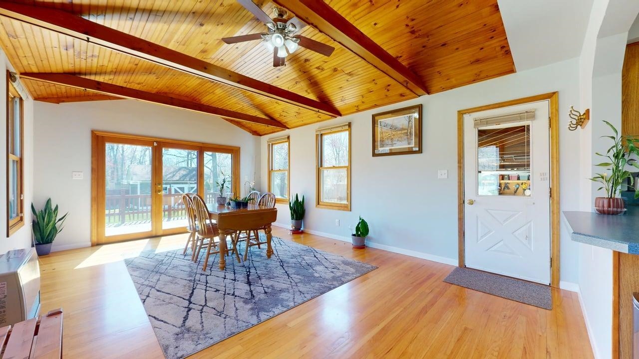 Welcome to this beautiful light and bright ranch style home located less than 10 minutes from Mallets Bay! This home has a fully fenced in back yard with garden space and mature grapevine arbor. The backyard has a shed equipped with electricity for your lawn care and shop needs. Step into this three bedroom home offering a separate dining area off the kitchen. Conveniently located full bath by the three bedrooms. the living room has ample windows to offer streaming natural light. Additionally a large family room in the basement offers so much opportunity. The dining room has cathedral ceilings which leads to the back trexs deck then into the private yard. You will have plenty of space in the 2 1/2 bay garage that has full overhead door access to the front of the home with paved driveway and back yard as well. The home is beautiful with wood flooring throughout the first floor. The home is lined with inviting curb appeal.