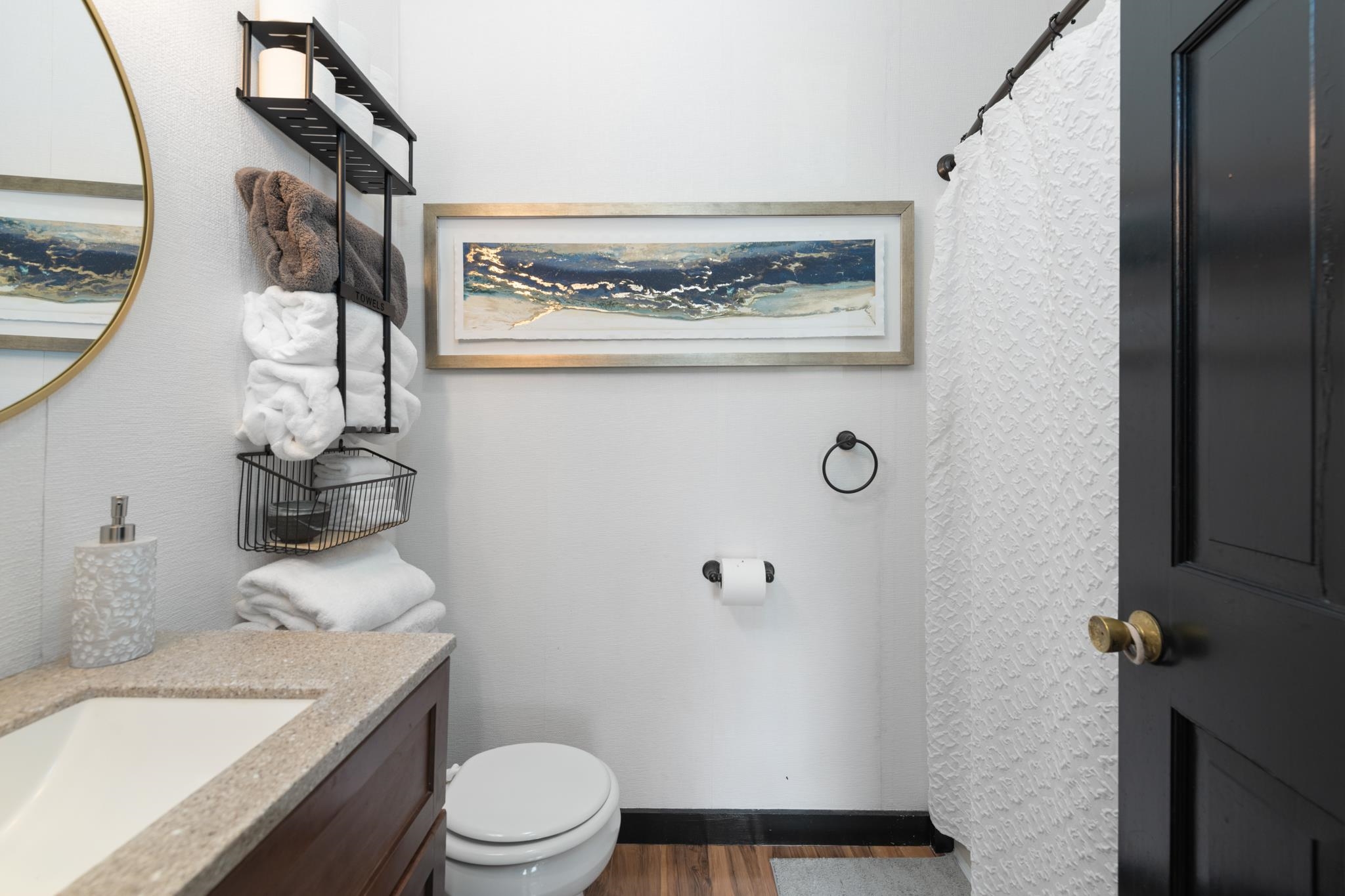 This full bathroom right off the kitchen has been updated