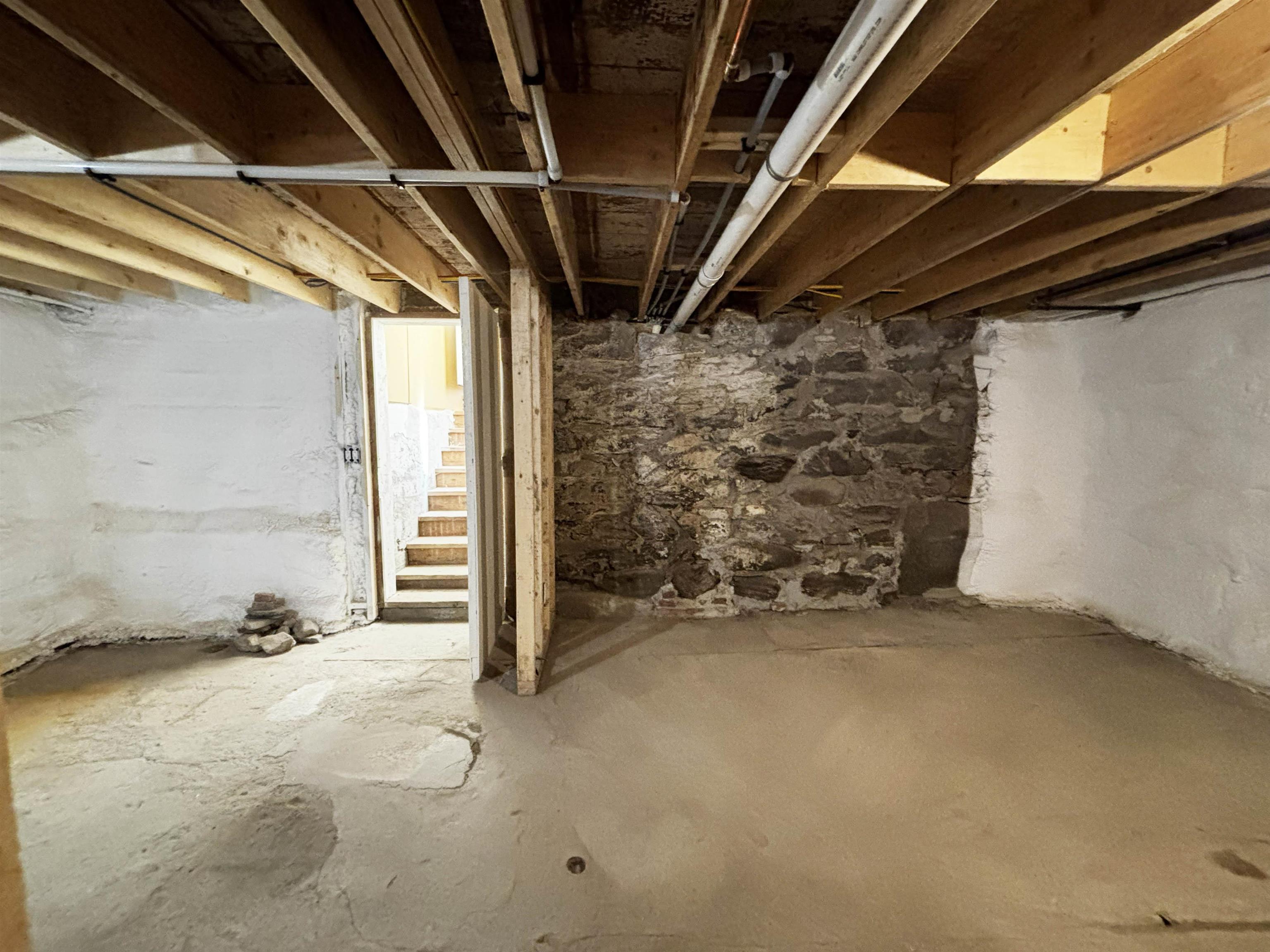Basement leading to upstairs storage area
