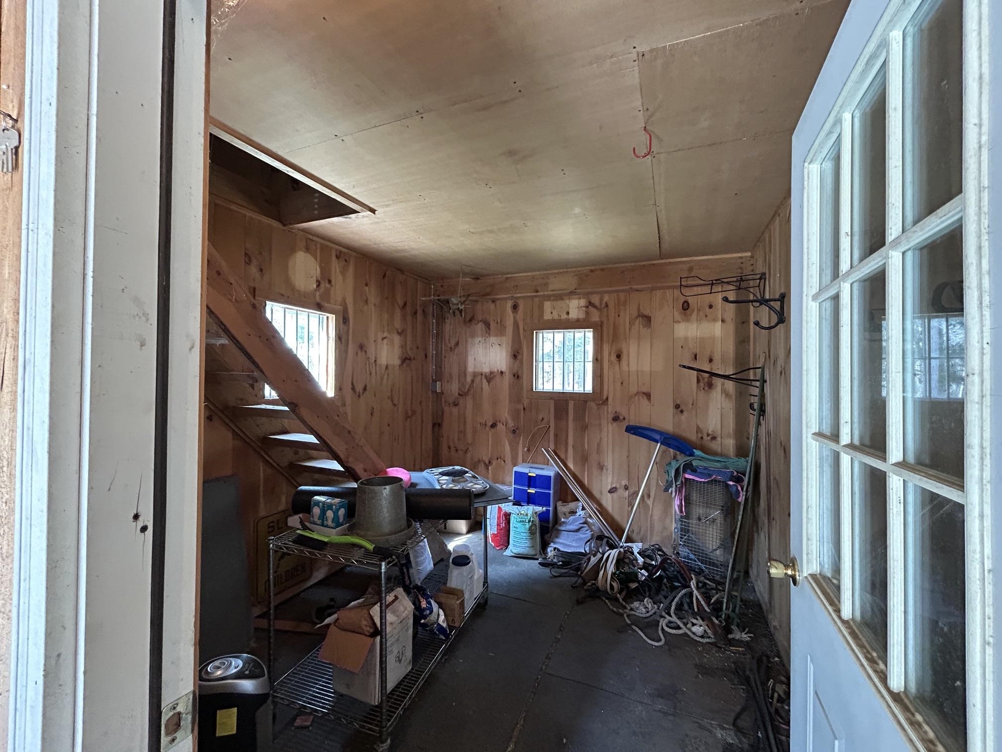 Tack room, stairs to hayloft 25182166
