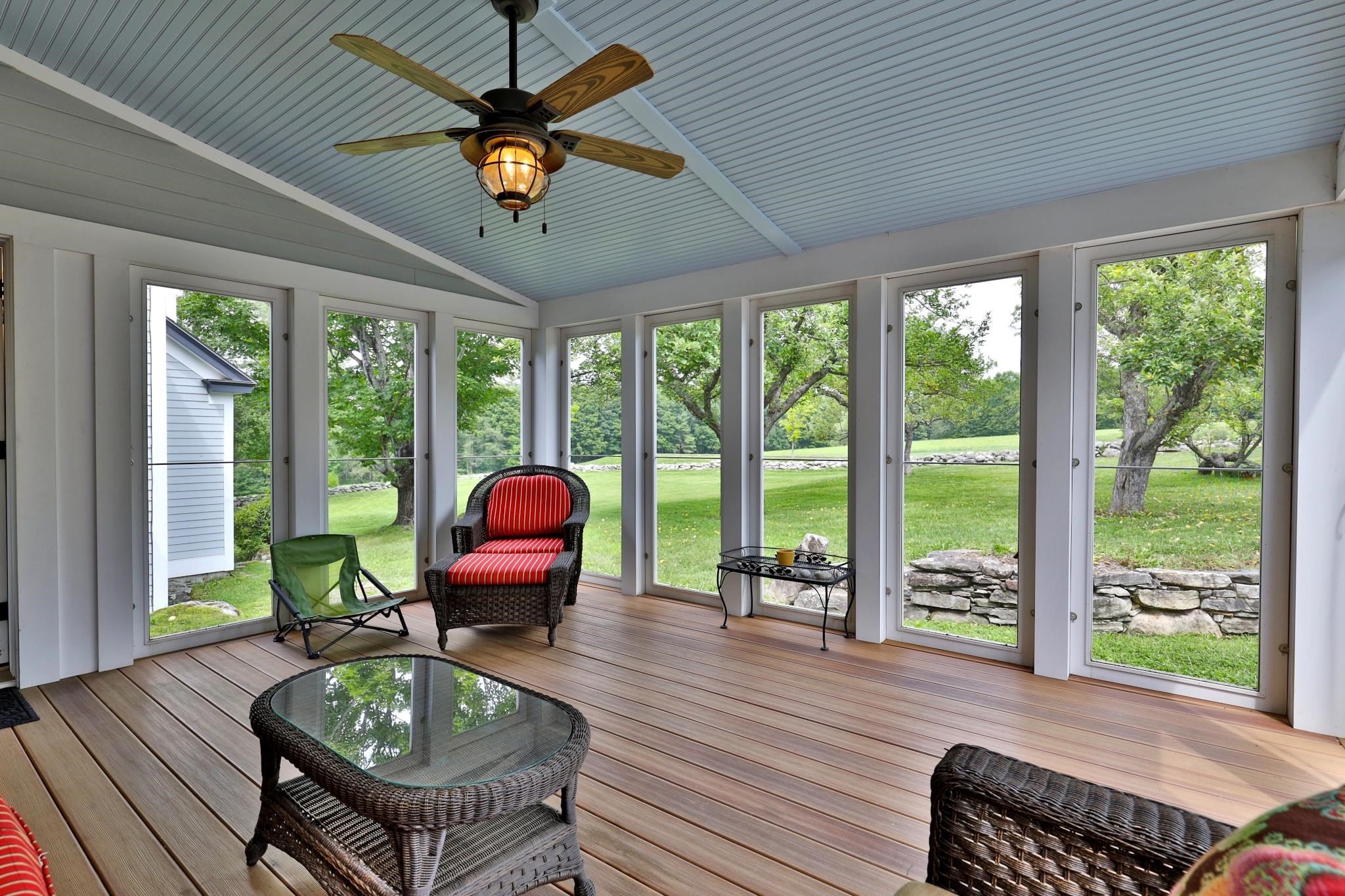 Screened in porch overlooking apple trees and bocce court 25195302