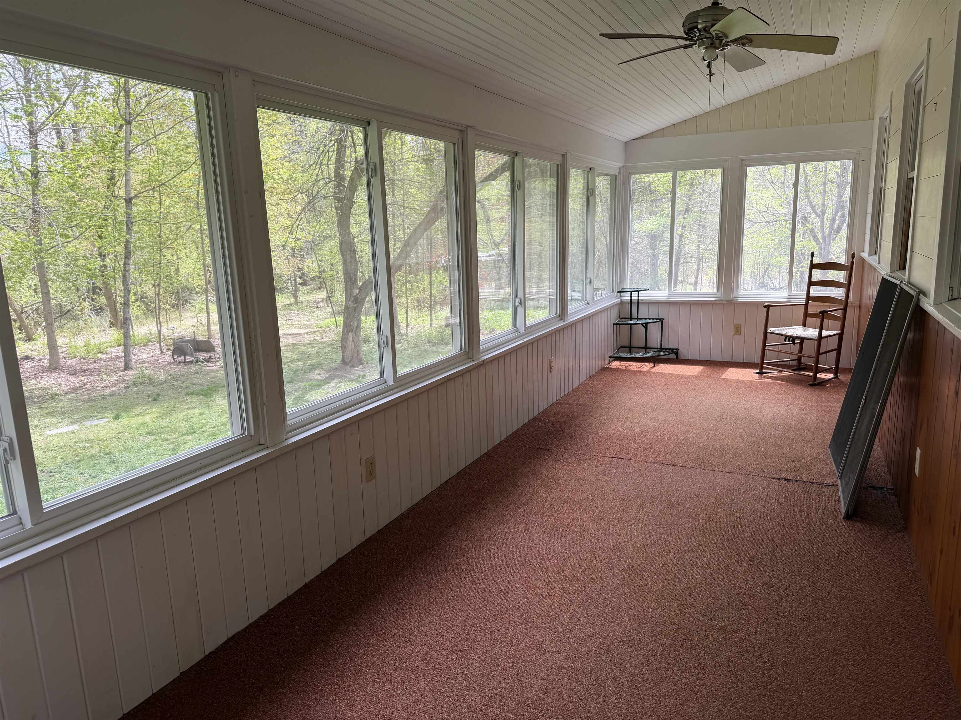 Enclosed porch overlooking the river