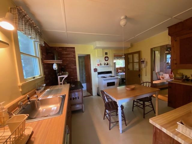 Old wood cookstove on the left
