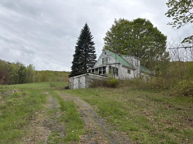 Uninhabitable house on property