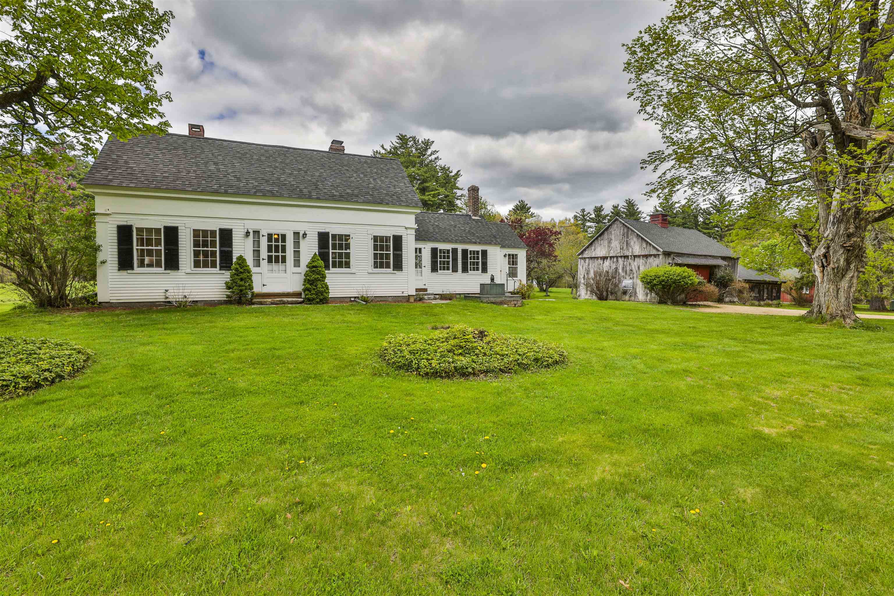 Once in a lifetime offering consisting of TWO PARCELS with 46.98 Acres and a antique Cape and Barn. 1 Featherbed Lane consists of 26.6 stunning acres of field and forest with a classic New England cape and barn with frontage on both Featherbed Lane and Island Pond Road. This 1850's home boasts a spacious kitchen with dining area that leads to a sun filled porch. The dining room overlooks the front yard and flows to a first floor office space with half bathroom. The front entry contains a classic turned center stairwell with a spacious living room adjacent. Upstairs there are 2 nicely sized bedrooms and a full bathroom. The barn is large and ideal for storage as well as having ample area for livestock. There is a garage as well as additional storage under a large lean-to. A small pond and beautiful stone walls adorn the property. 59-69 Island Pond Road consists of 20.48 Acres of fields and woodlands directly across the road featuring frontage on Island Pond Road as well as Featherbed Lane. This parcel boast generally level topography as well as stunning fields and forests that are adorned with stone walls. The meticulously cared for property is ideal for many uses including Conservation, Farming and Development. Current use penalty if any is the responsibility of the buyer.