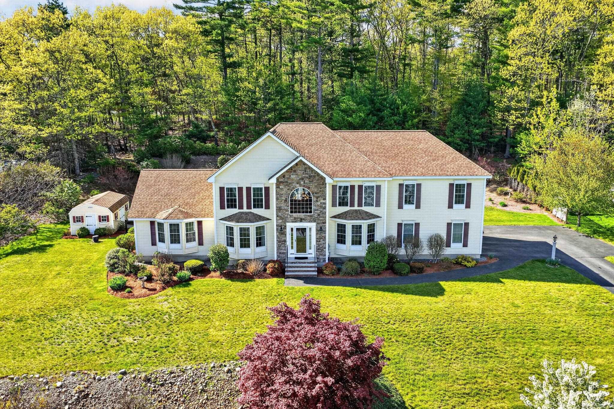 Welcome to Mulberry Estates, one of Pelham’s most sought-after neighborhoods, where luxury, comfort, and community come together. Set on a beautifully landscaped lot with picturesque surroundings, this impressive 4-bedroom home offers exceptional living spaces designed for both everyday comfort and unforgettable entertaining. The heart of the home is the spacious chef’s kitchen featuring rich cherry cabinetry, granite countertops, stainless steel appliances, an oversized refrigerator, abundant prep space, and a large center island that naturally becomes the gathering place for family and friends. The open flow continues into the dramatic great room with soaring cathedral ceilings, abundant natural light, and a cozy fireplace, while the elegant dining room and stunning two-story foyer add timeless character throughout. Upstairs, the expansive primary suite feels like a private retreat with two oversized walk-in closets and a spa-inspired bathroom complete with a double vanity, soaking tub, and steam shower. The additional bedrooms offer generous space and flexibility for family, guests, or home office needs. The finished lower level was designed for entertaining, featuring a half bath, wet bar, an electric fireplace and included pool table, perfect for game nights and gatherings. Step outside and enjoy your own backyard oasis with an inground pool, spacious patio, pergola seating area, and beautifully maintained grounds that create the perfect setting for summer nights and weekend entertaining. Located in desirable Mulberry Estates with convenient access to shopping, dining, and commuter routes, this home delivers the lifestyle buyers have been waiting for. Schedule your private showing today or stop by the Open Houses Sat/Sun 11-1.