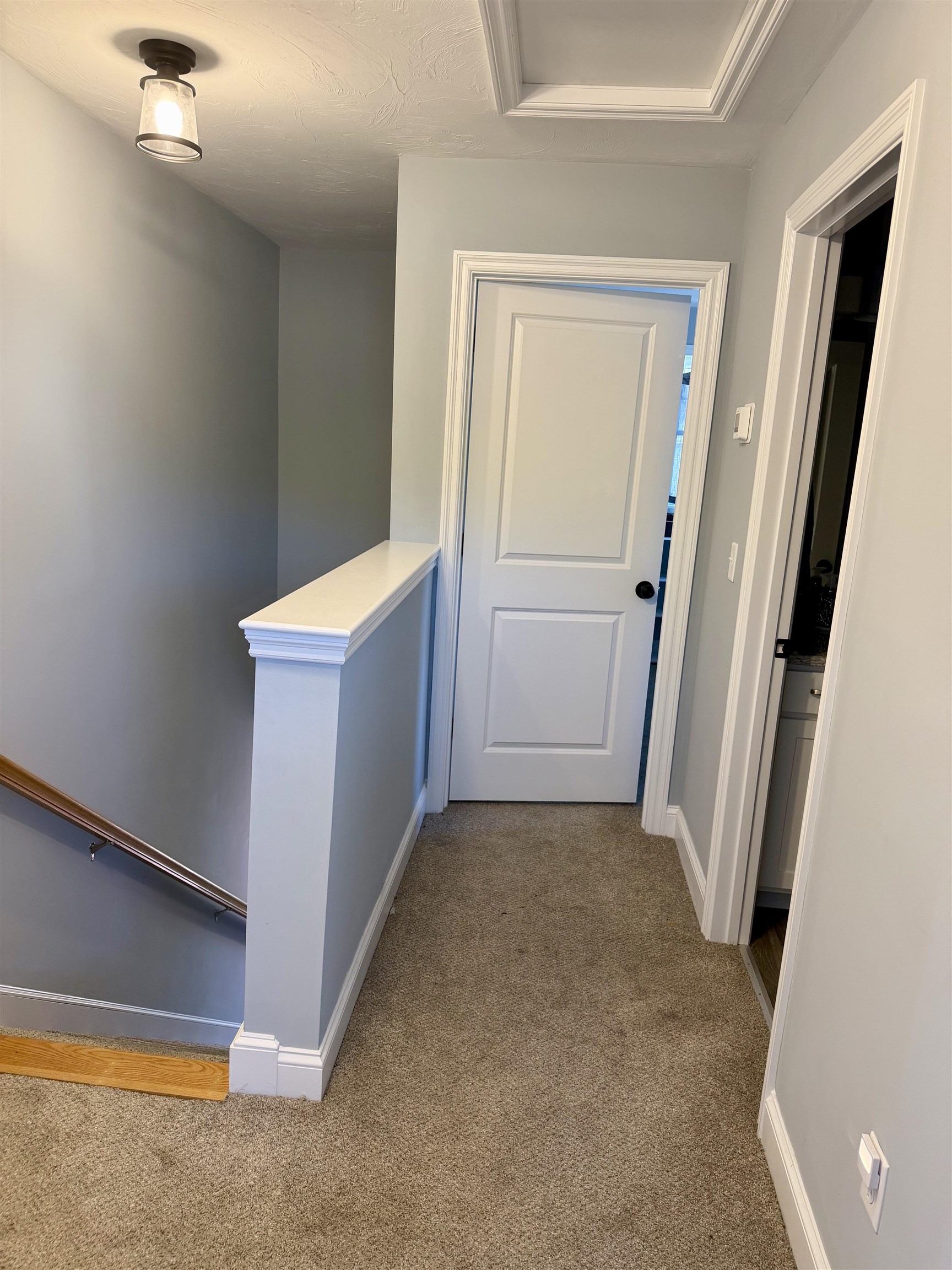 Looking towards 2nd bedroom, full bath to right.