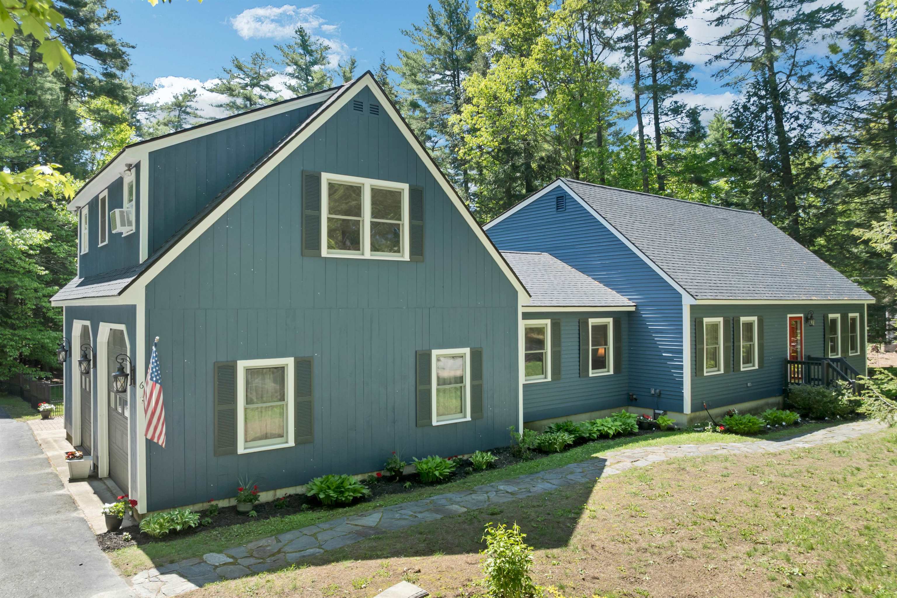 Set on a peaceful one-acre lot surrounded by trees