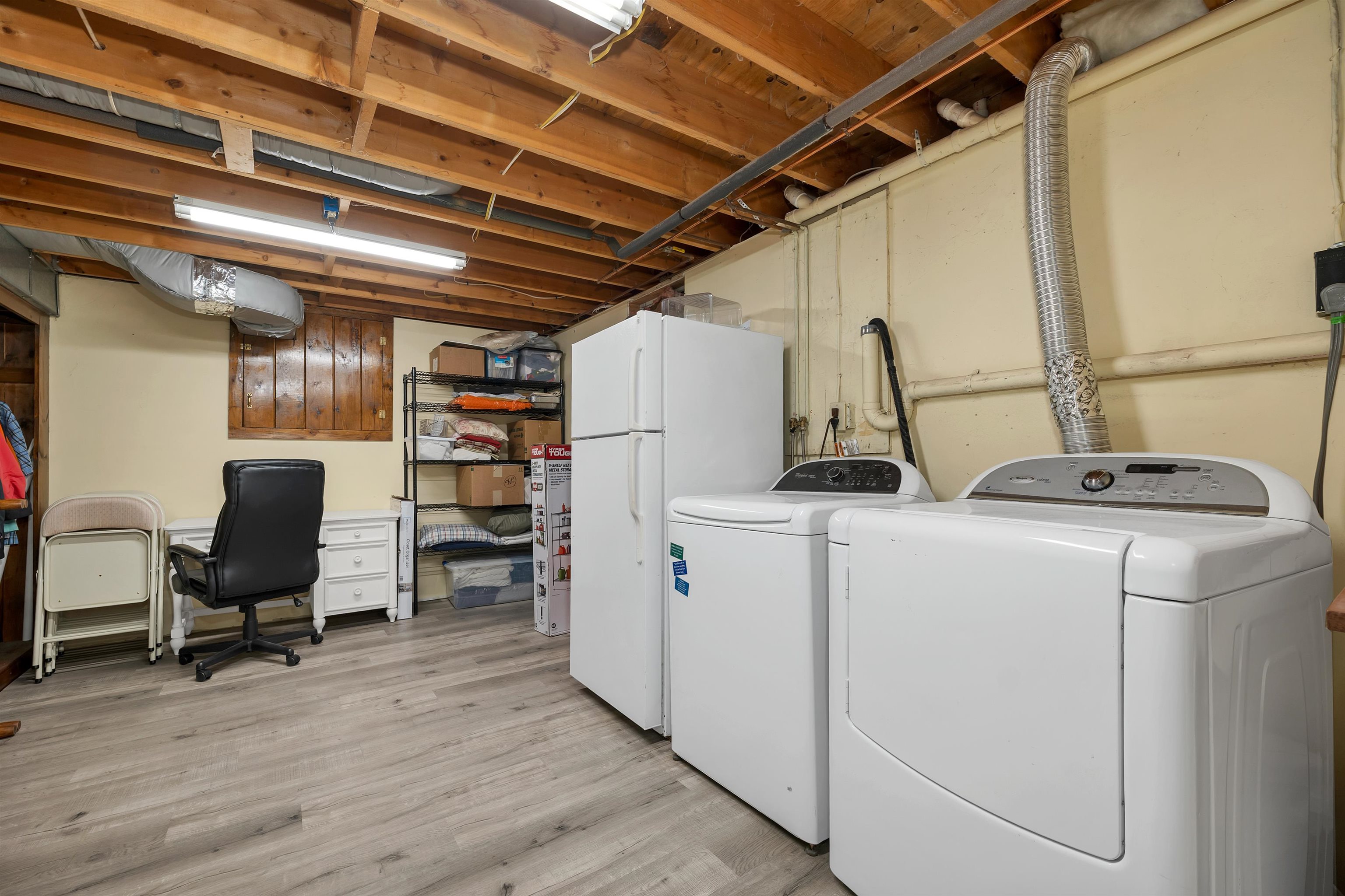 Lower-level laundry and utility space with practical storage.