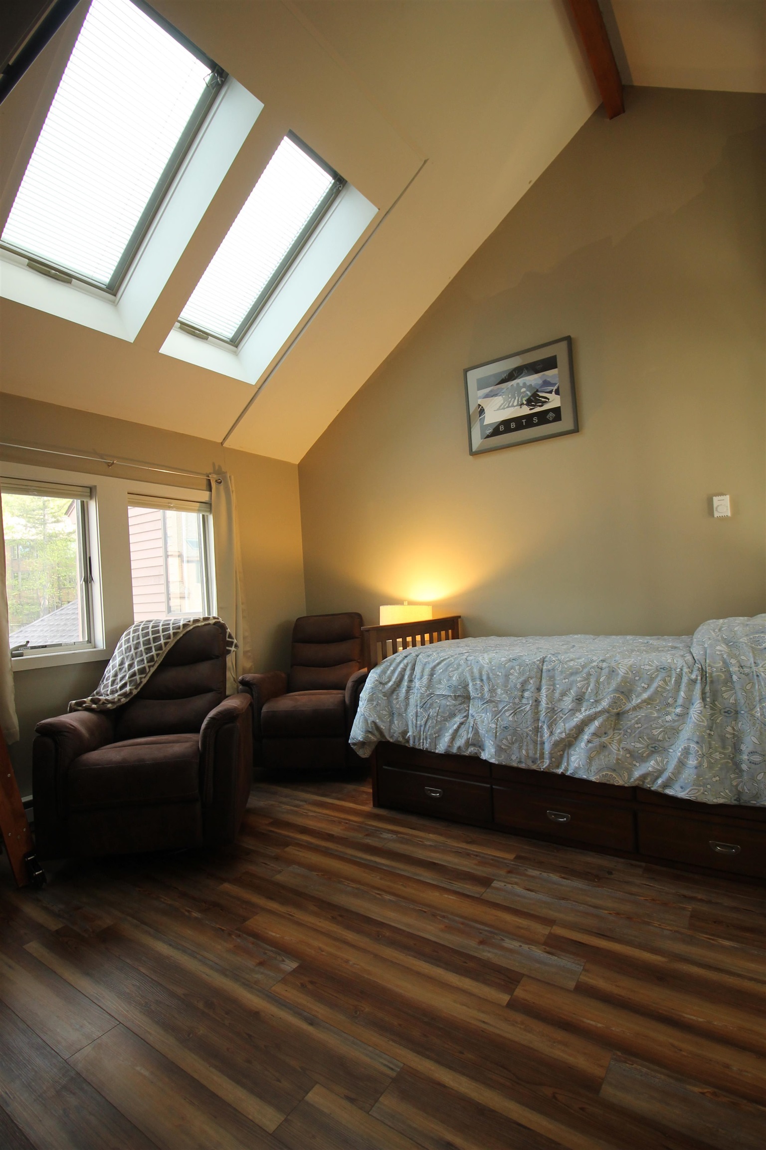 Bedroom 2 has vaulted ceilings