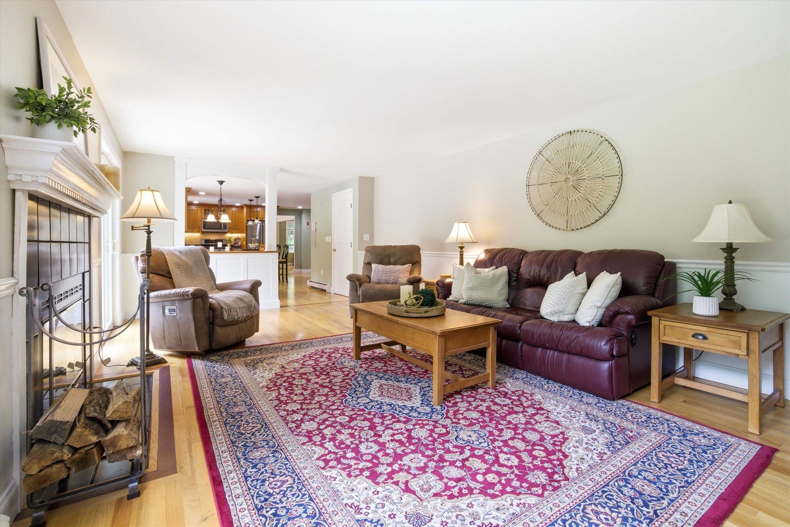 Warm and inviting family room featuring a cozy wood-burning fireplace.