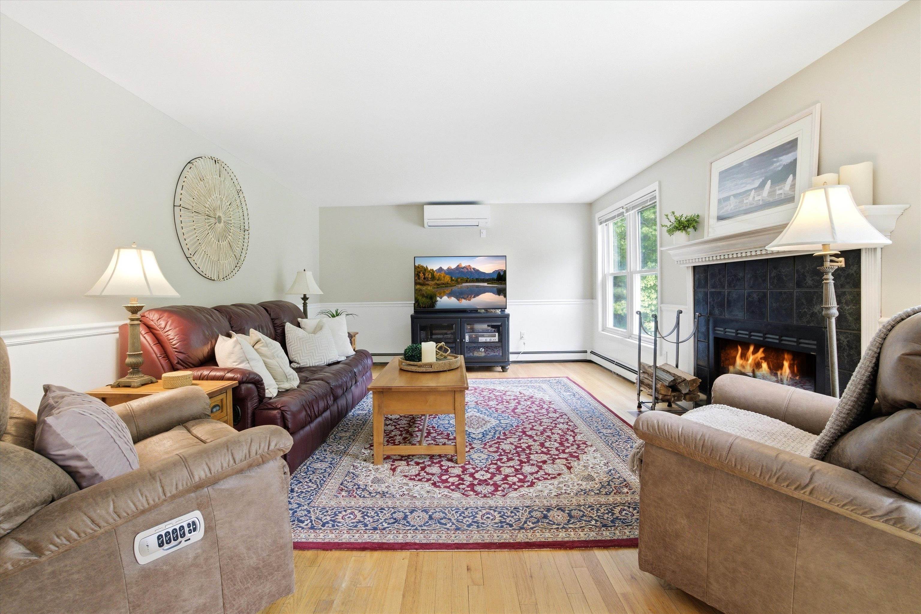 Sun-filled living area with picturesque views and year-round comfort from mini-splits.