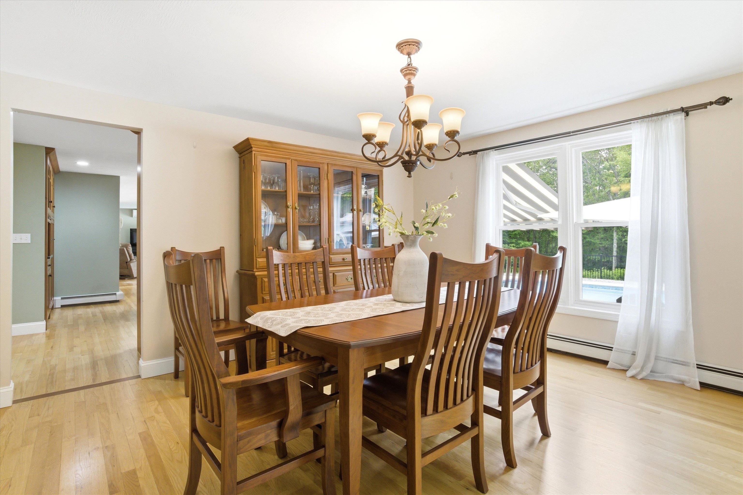 Formal dining room ideal for meals and holiday gatherings.