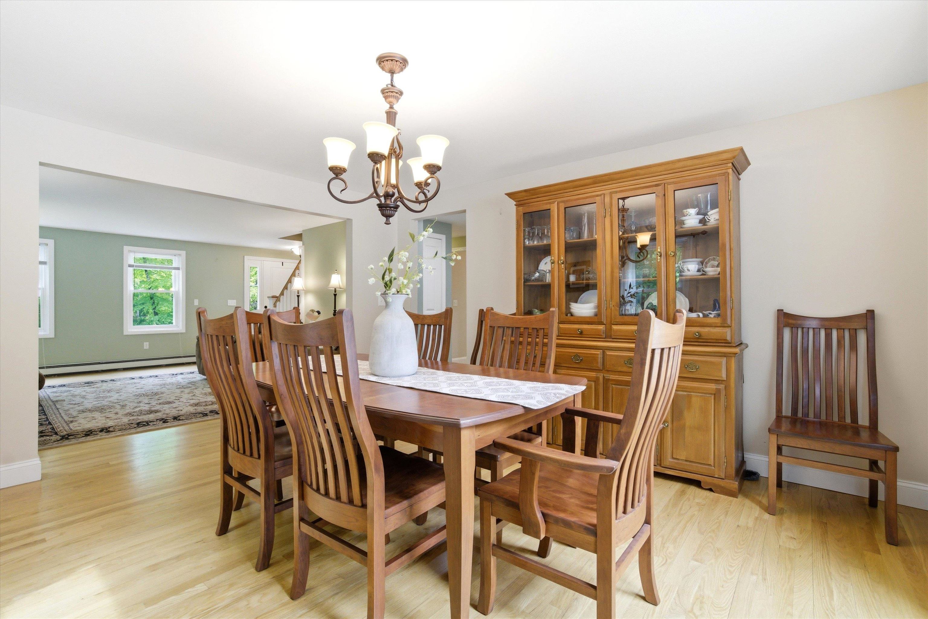 Elegant dining space with hardwood flooring and plenty of room to entertain.