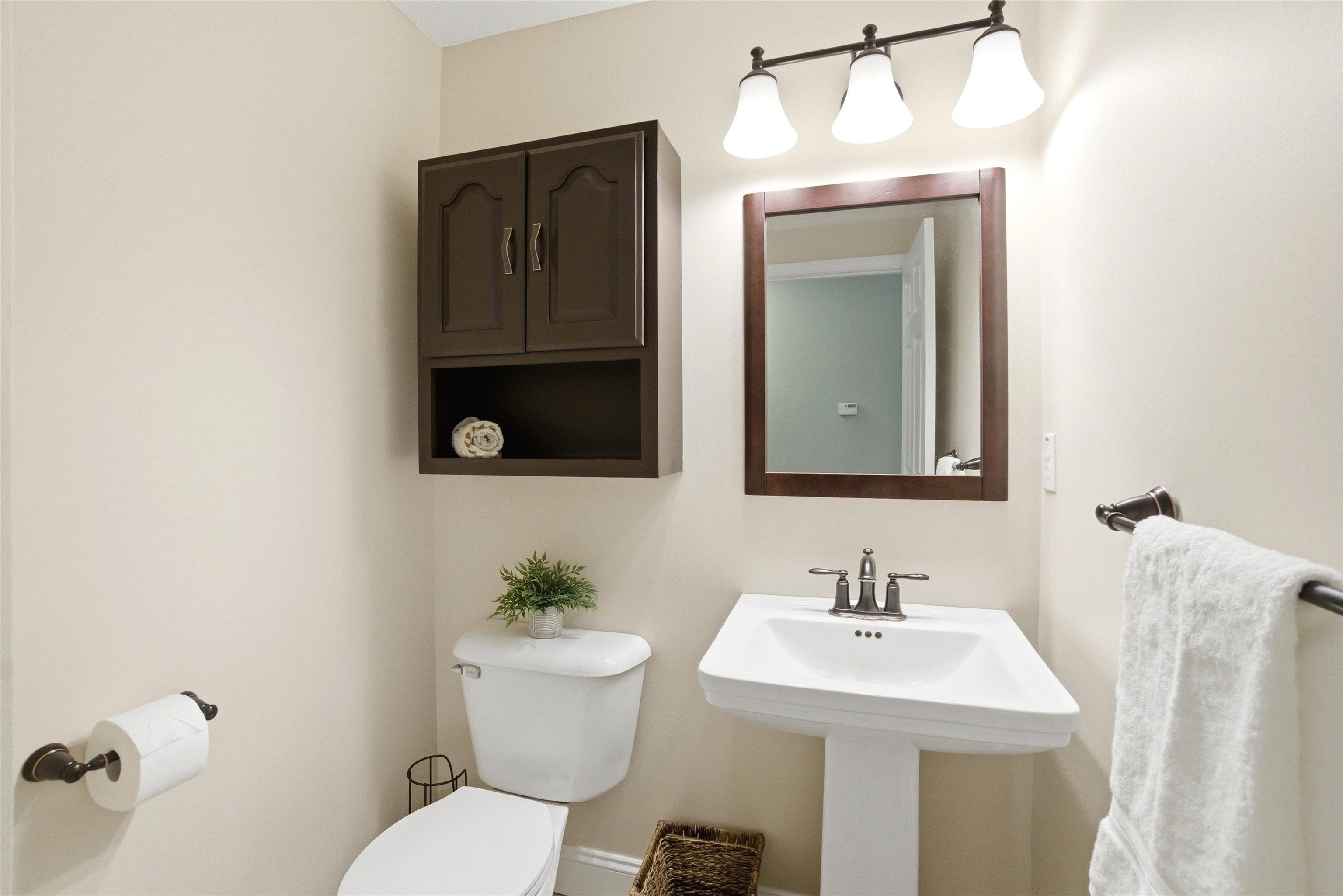 Stylish half bath on the main level - practical and easy.