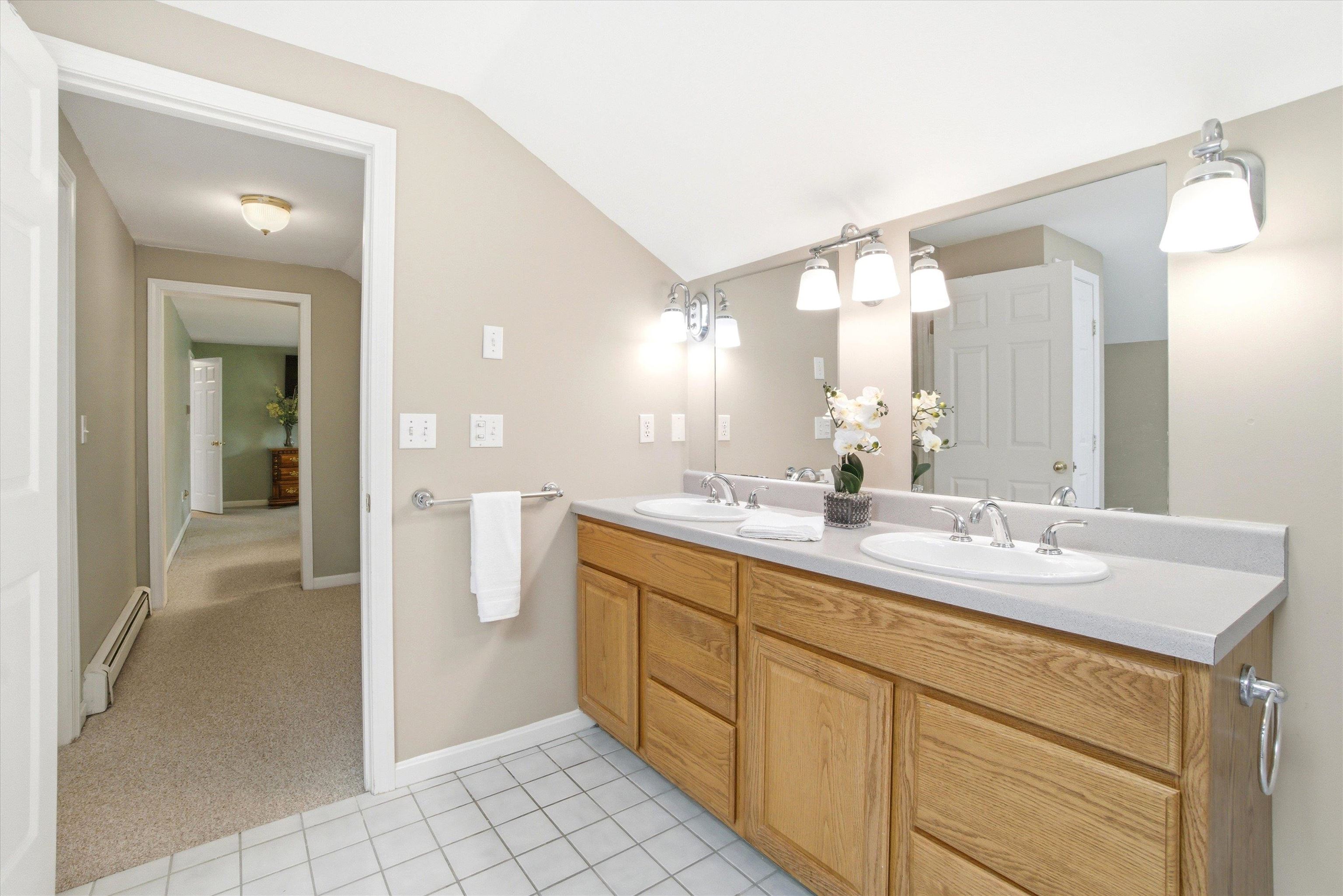 Generous vanity area with ample counter space for everyday convenience.