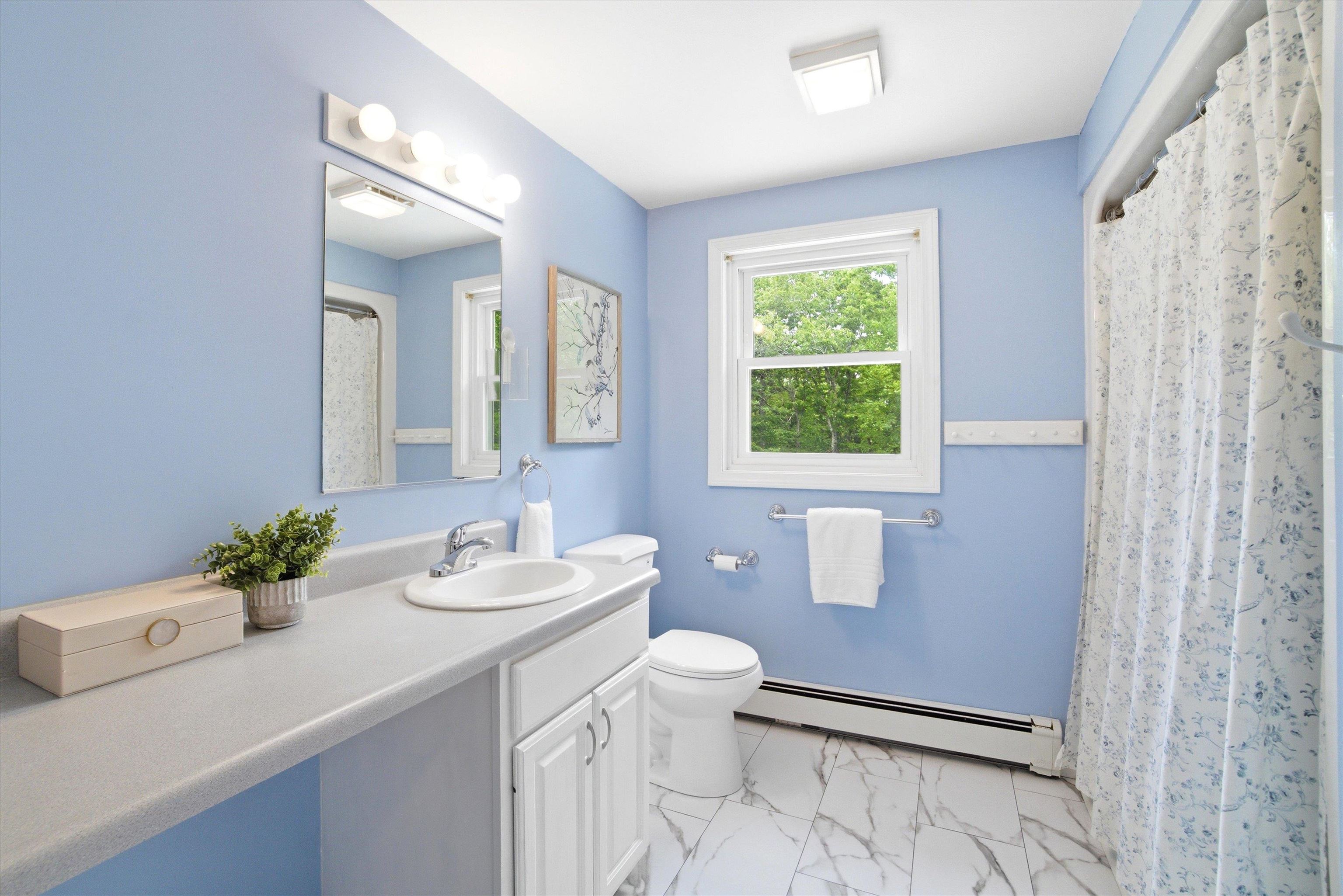 Spacious full shared bathroom designed for comfort and convenience.