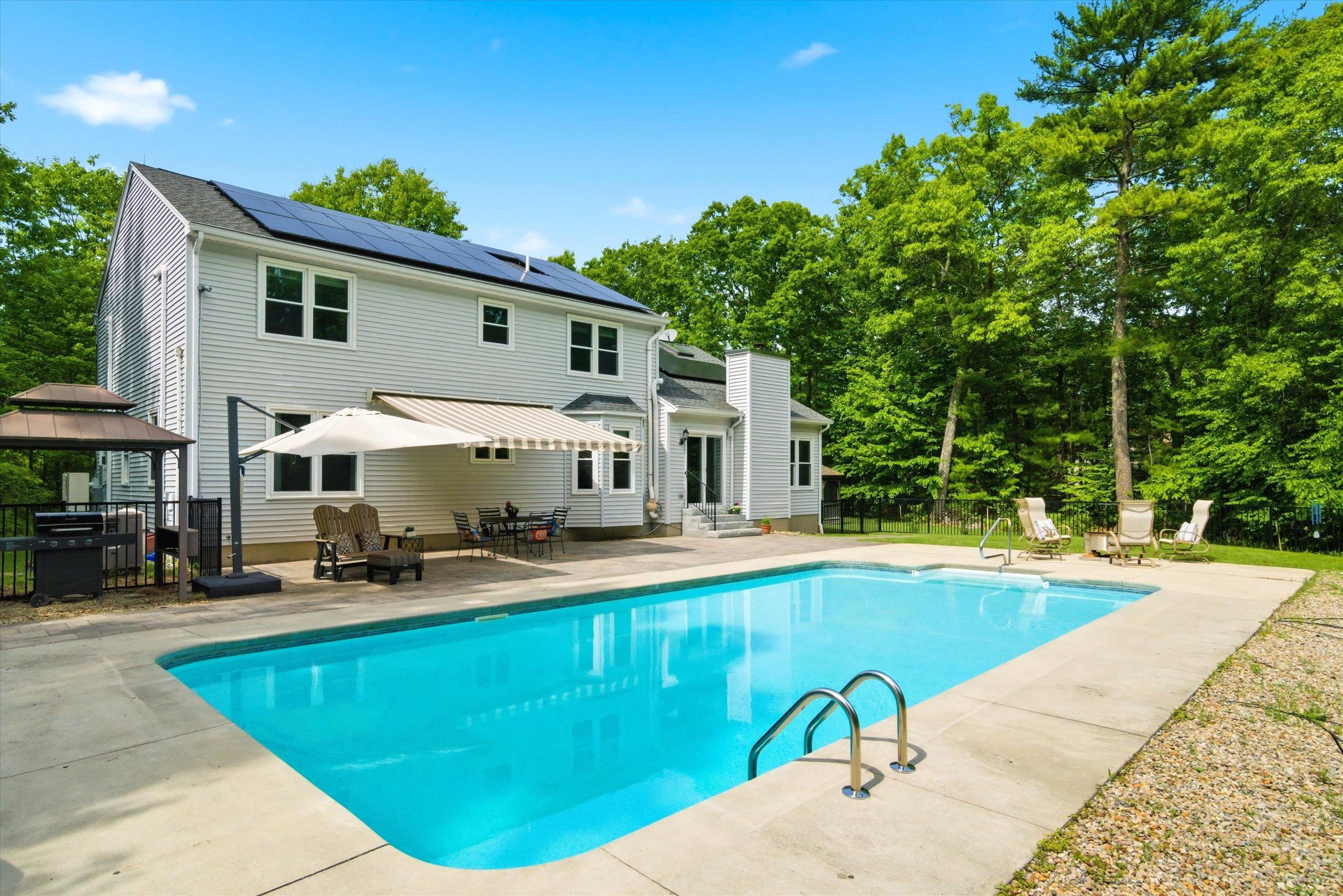 Resort-style backyard with pool and plenty of space for entertaining.