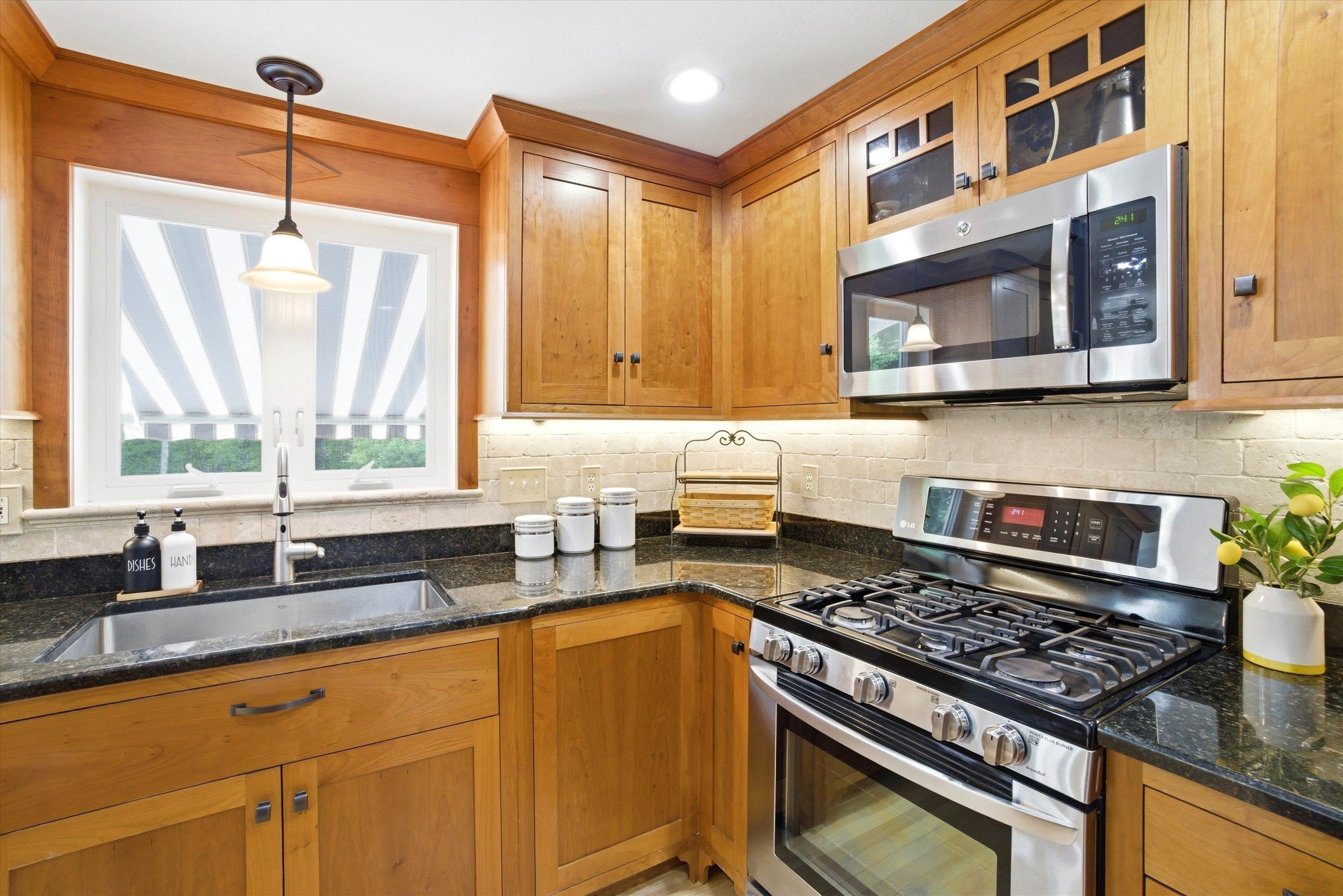 A chef-inspired kitchen offering abundant workspace and premium stainless-steel appliances.