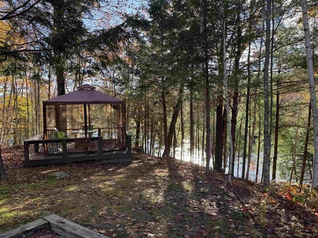 screened in waterfront gazebo