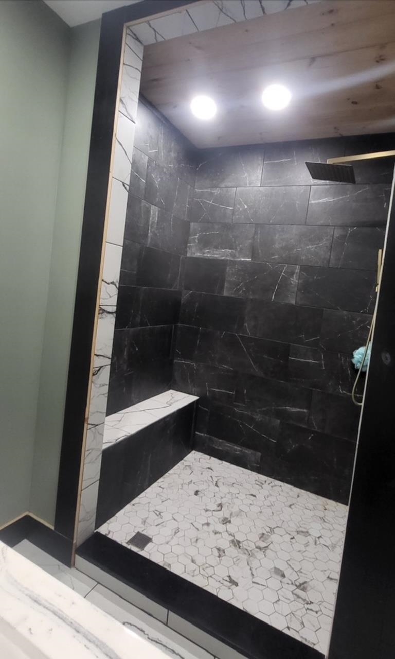 Hand crafted shower in primary