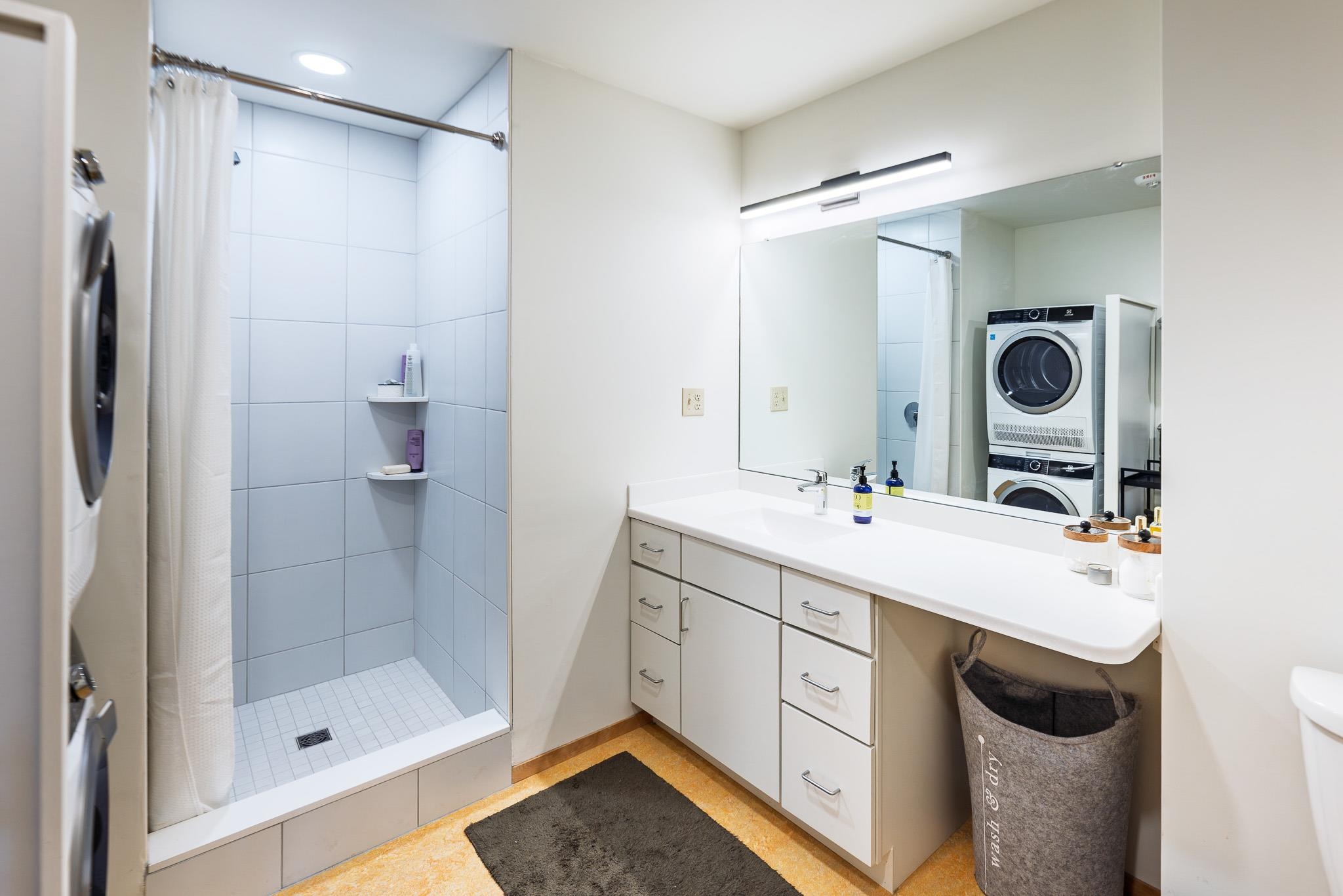 Primary bedroom 3/4 bath and laundry 25488556