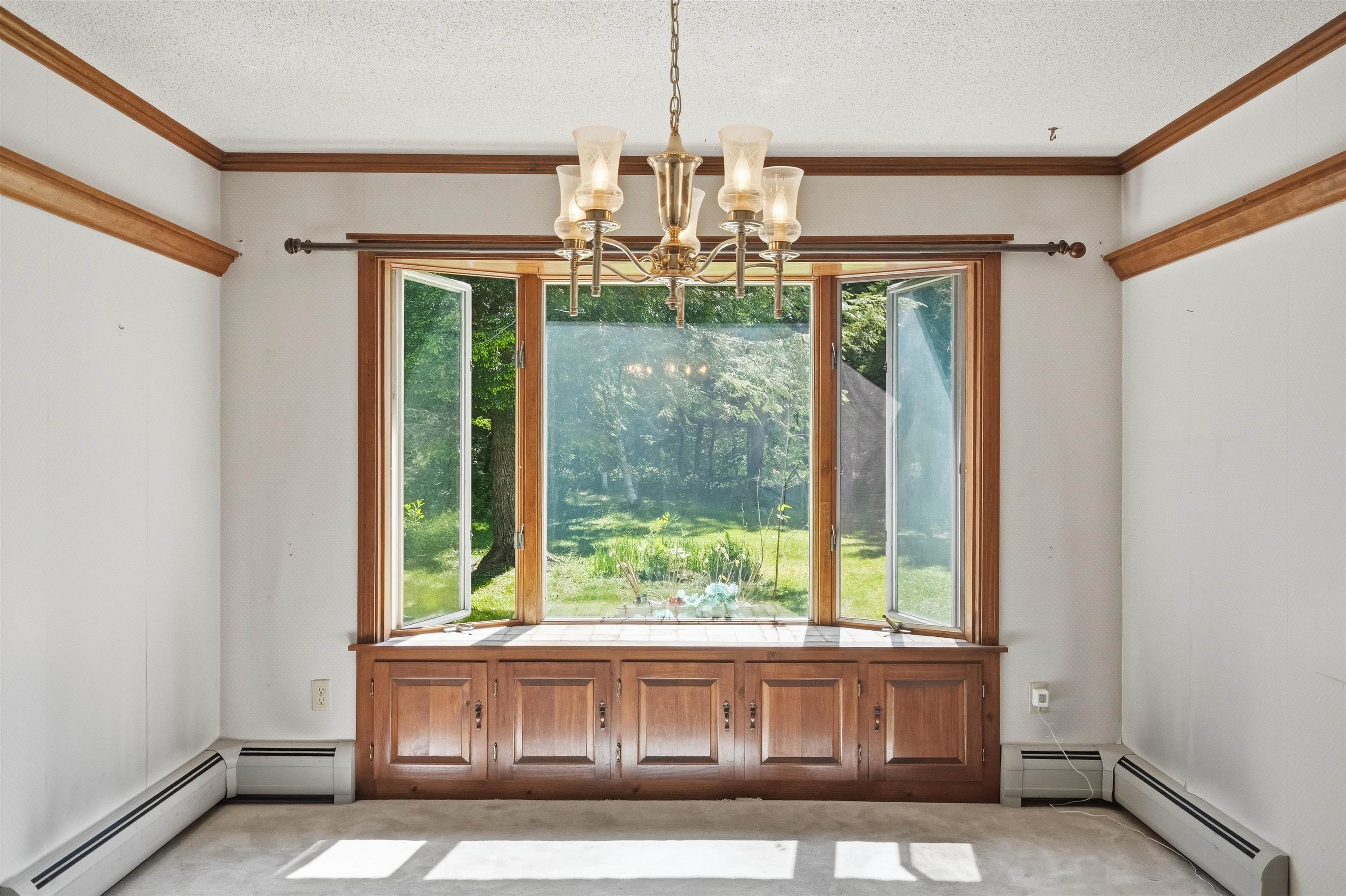 Large light filled dining area with window seat 25498046