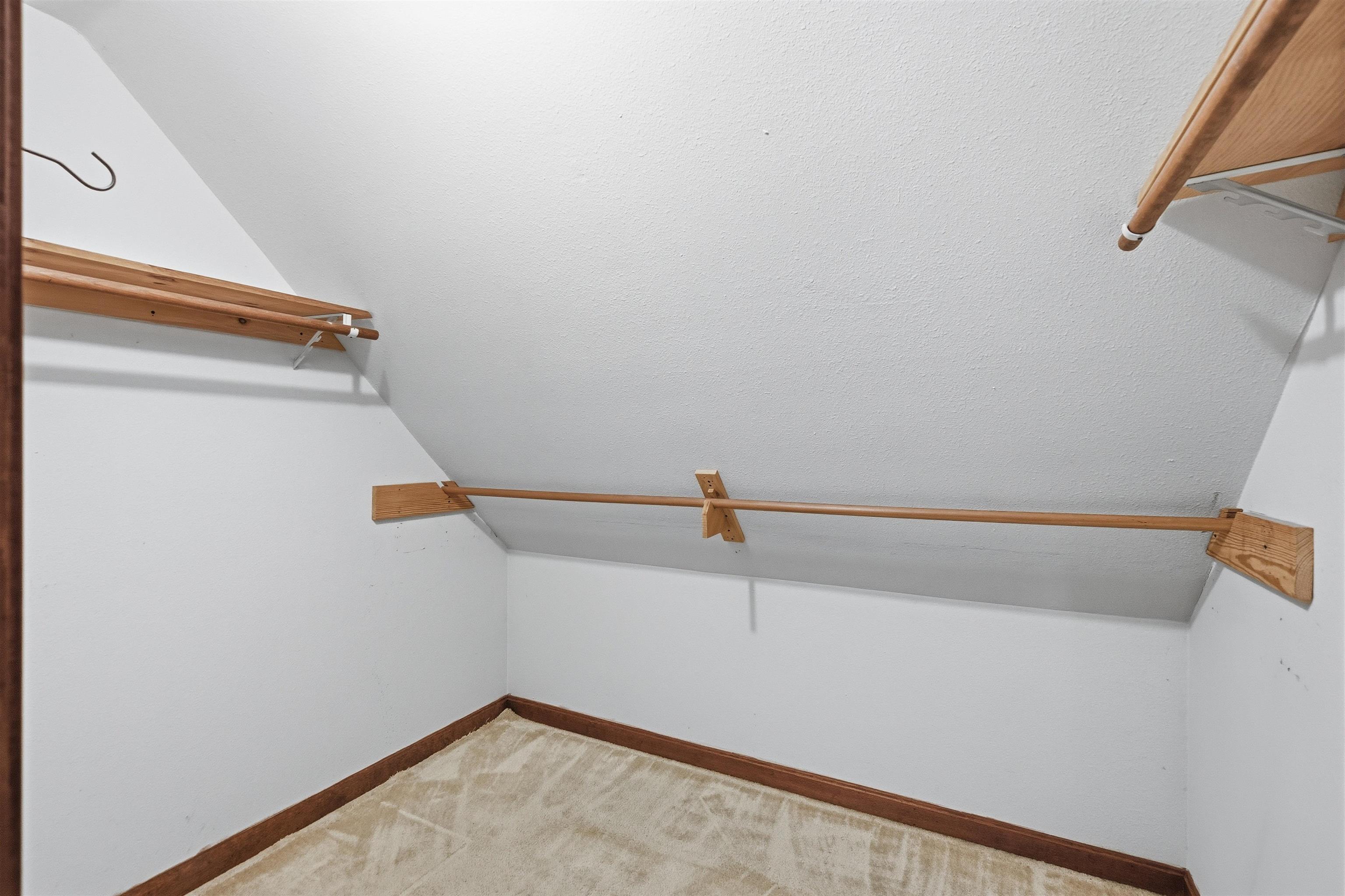 Large walk in closet is amoung many different closets and storage areas throughout the home 25498067