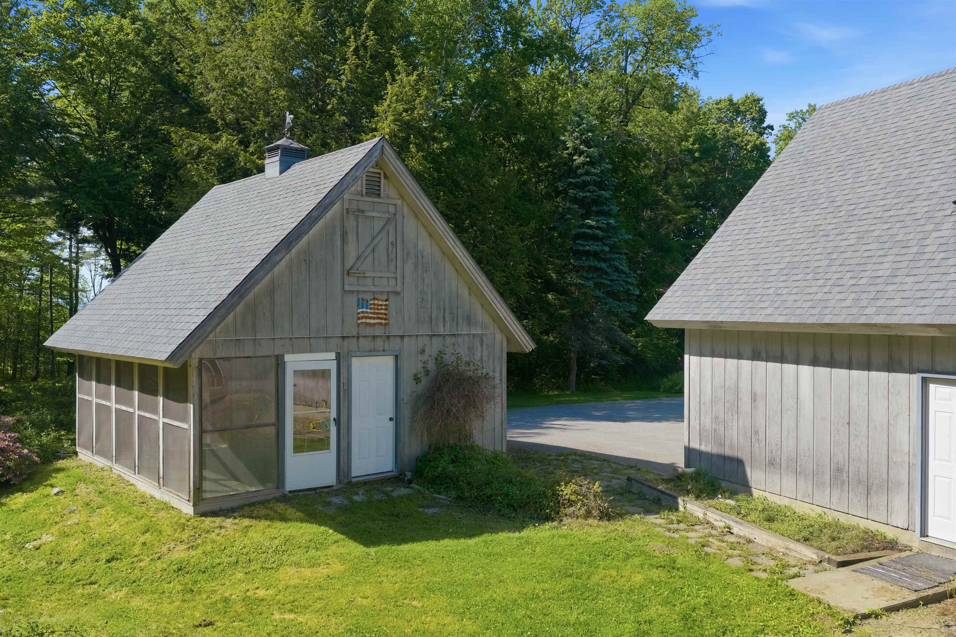 This detached garage offers an enclosed screened in porch 25498120