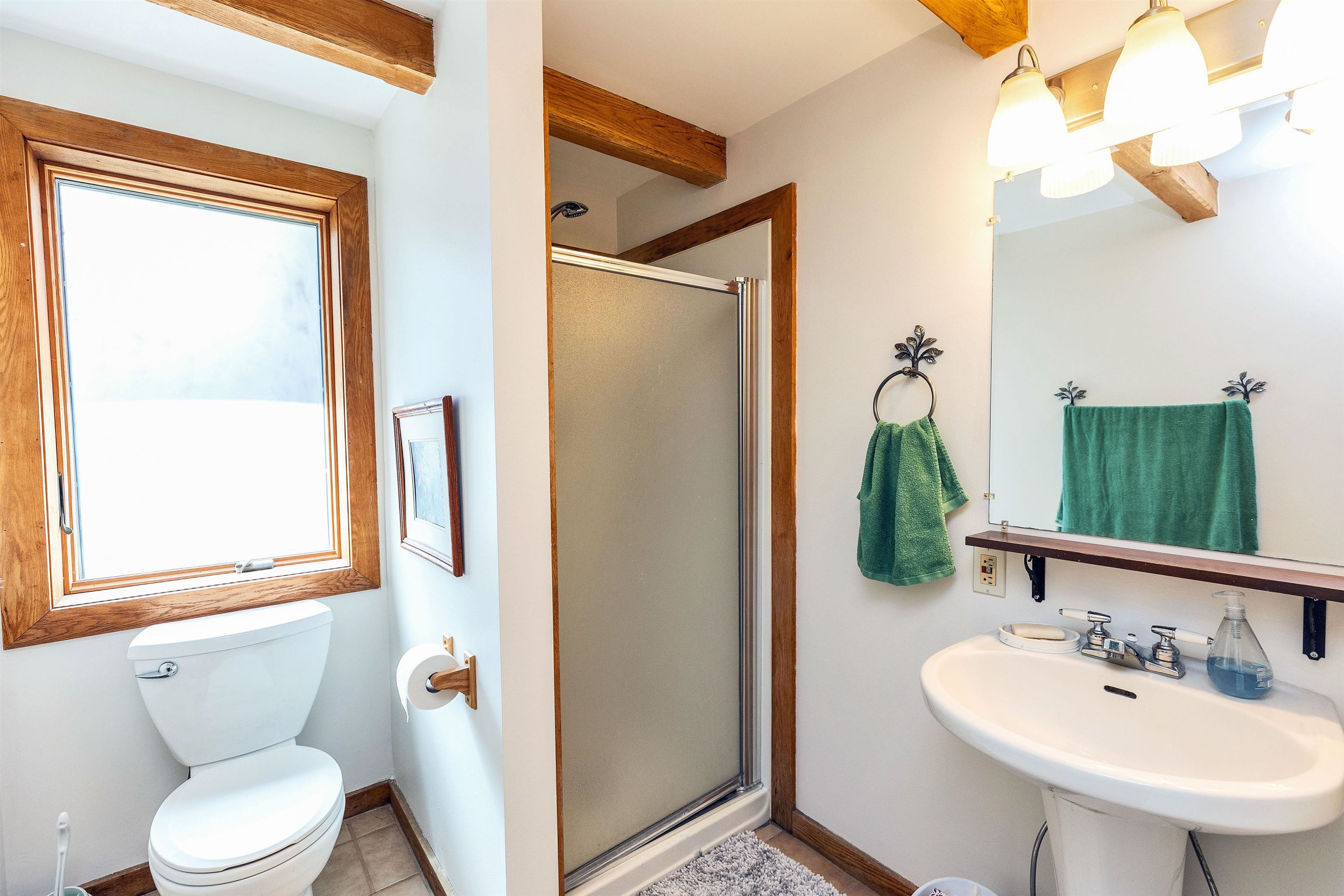 Shower bath at foot of staircase