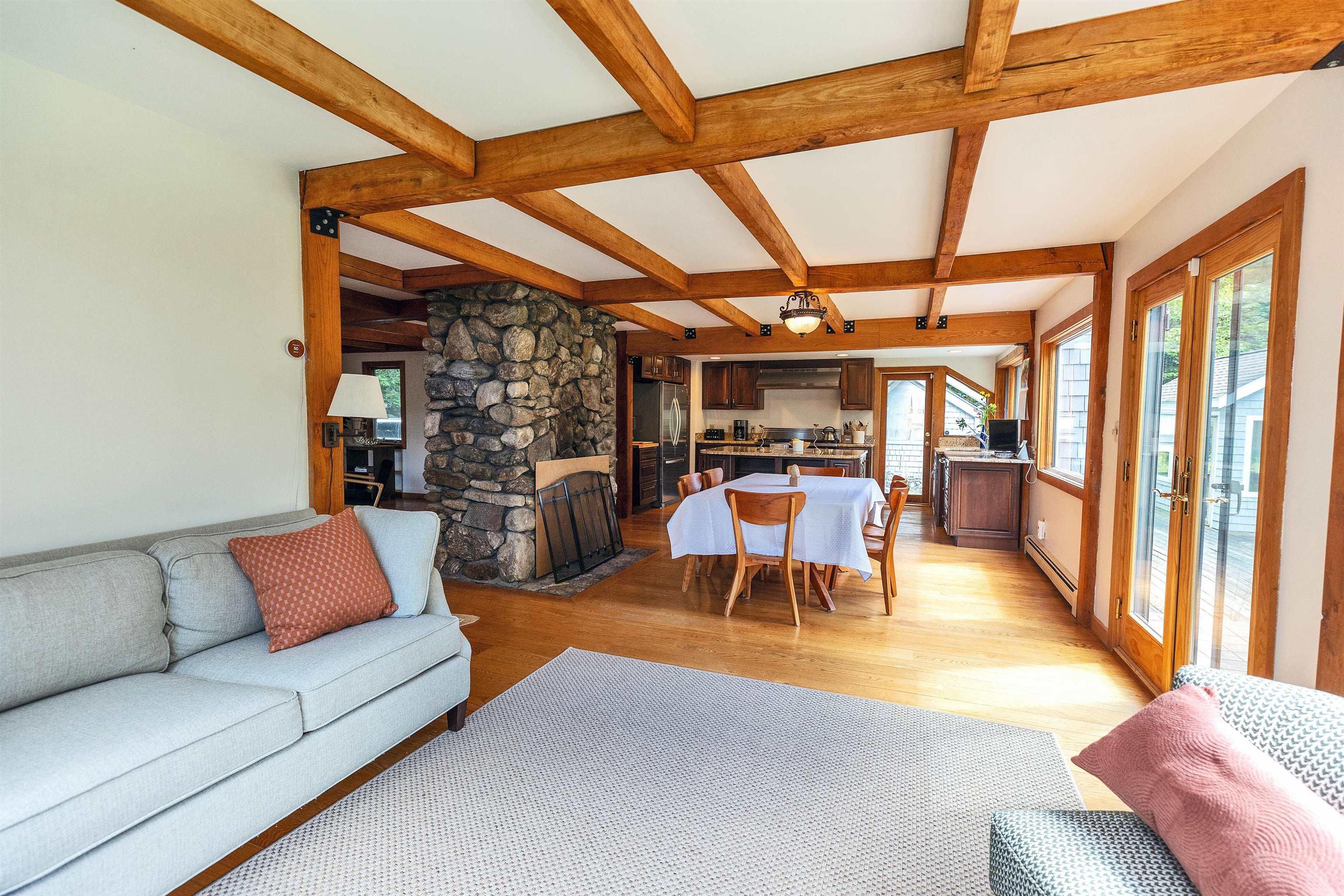 Sitting area viewing to dining room and kitchen