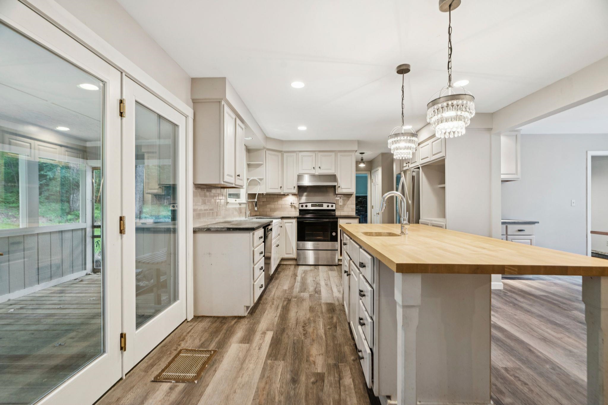 Kitchen looking into screen porch 25578155