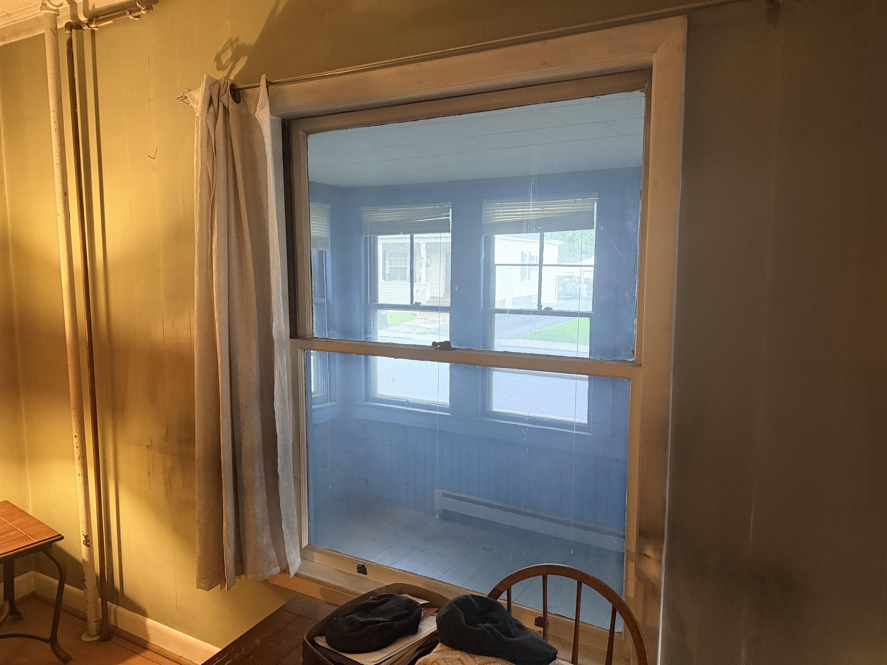 Liv Rm window looks to front porch