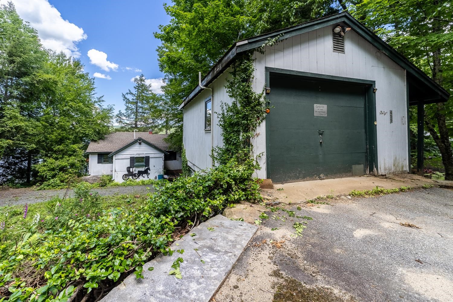 One car garage with storage above. 25647743