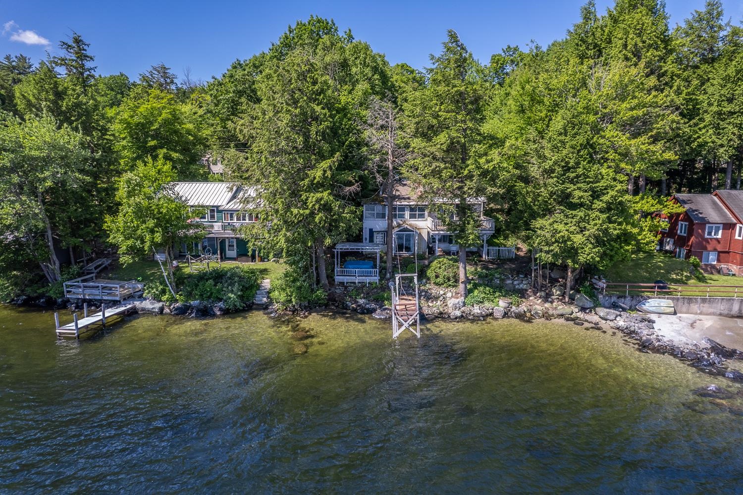 Home nestled among trees in a natural setting. 25647744