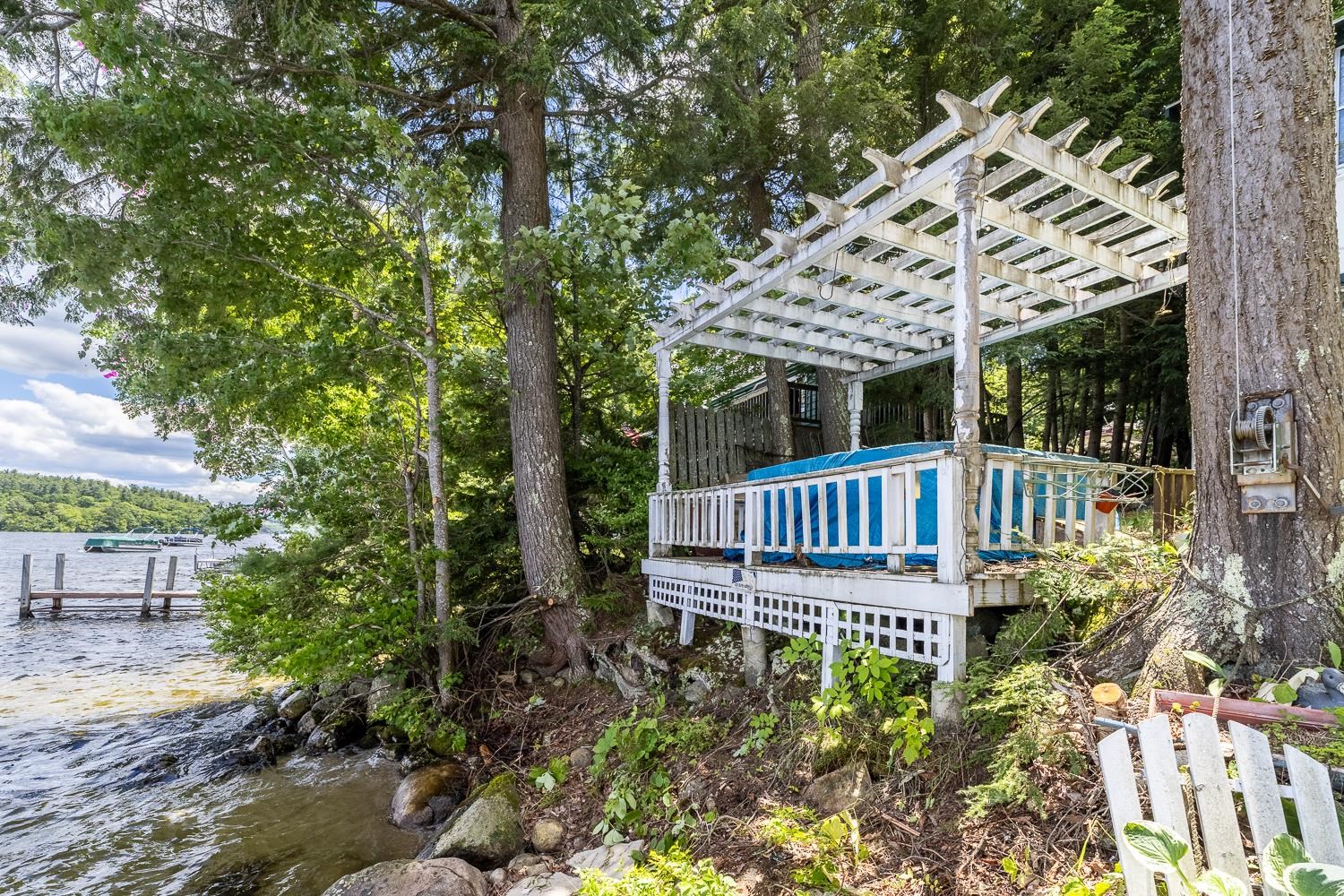 Incredible opportunity to reimagine the hot tub footprint with sweeping views of Newfound Lake. 25647716