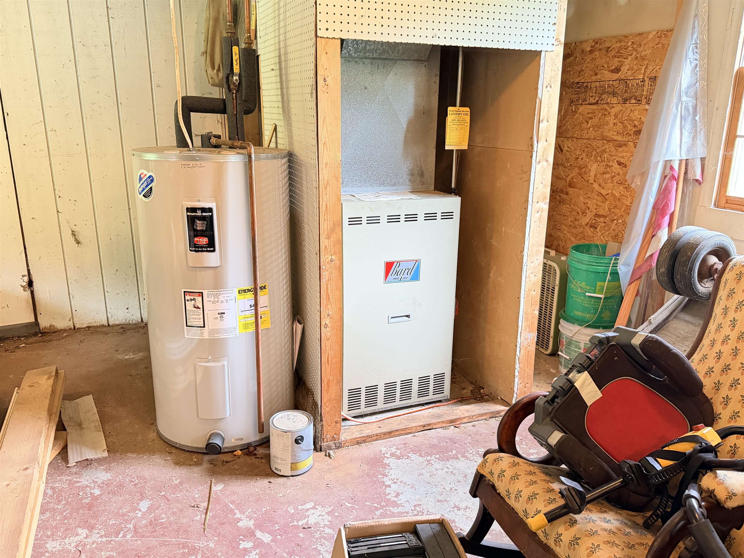 Heat source for garage and apartment above