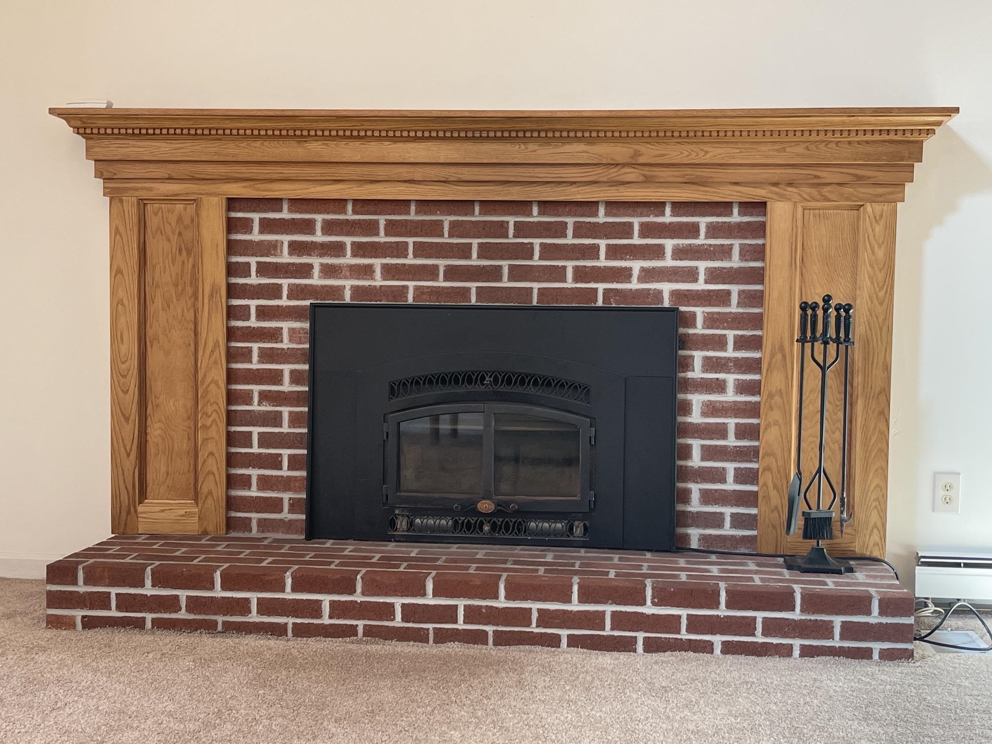 THERE IS A BRICK FIREPLACE WITH A 3 YEAR OLD WOODSTOVE INSERT FOR HEAT AND A COZY ATMOSPHERE.