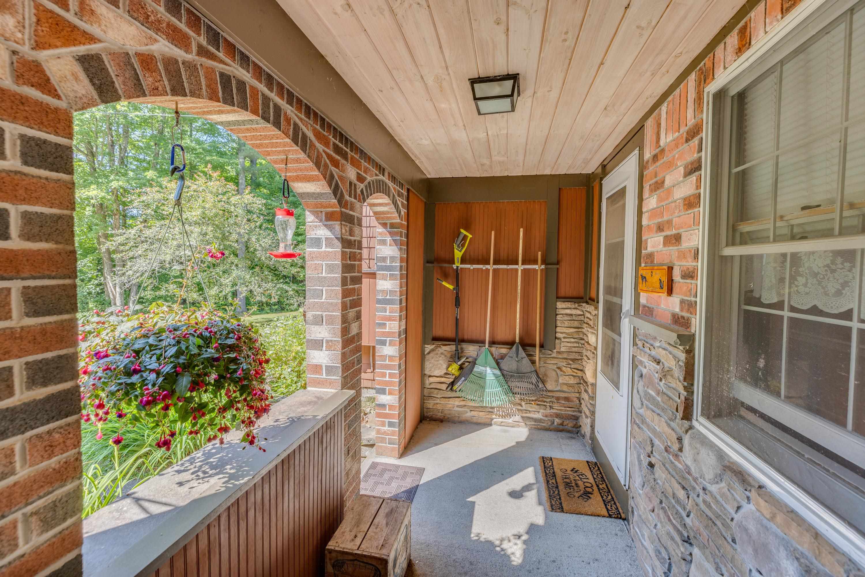 Brick Covered Archway Entry to Garage and House