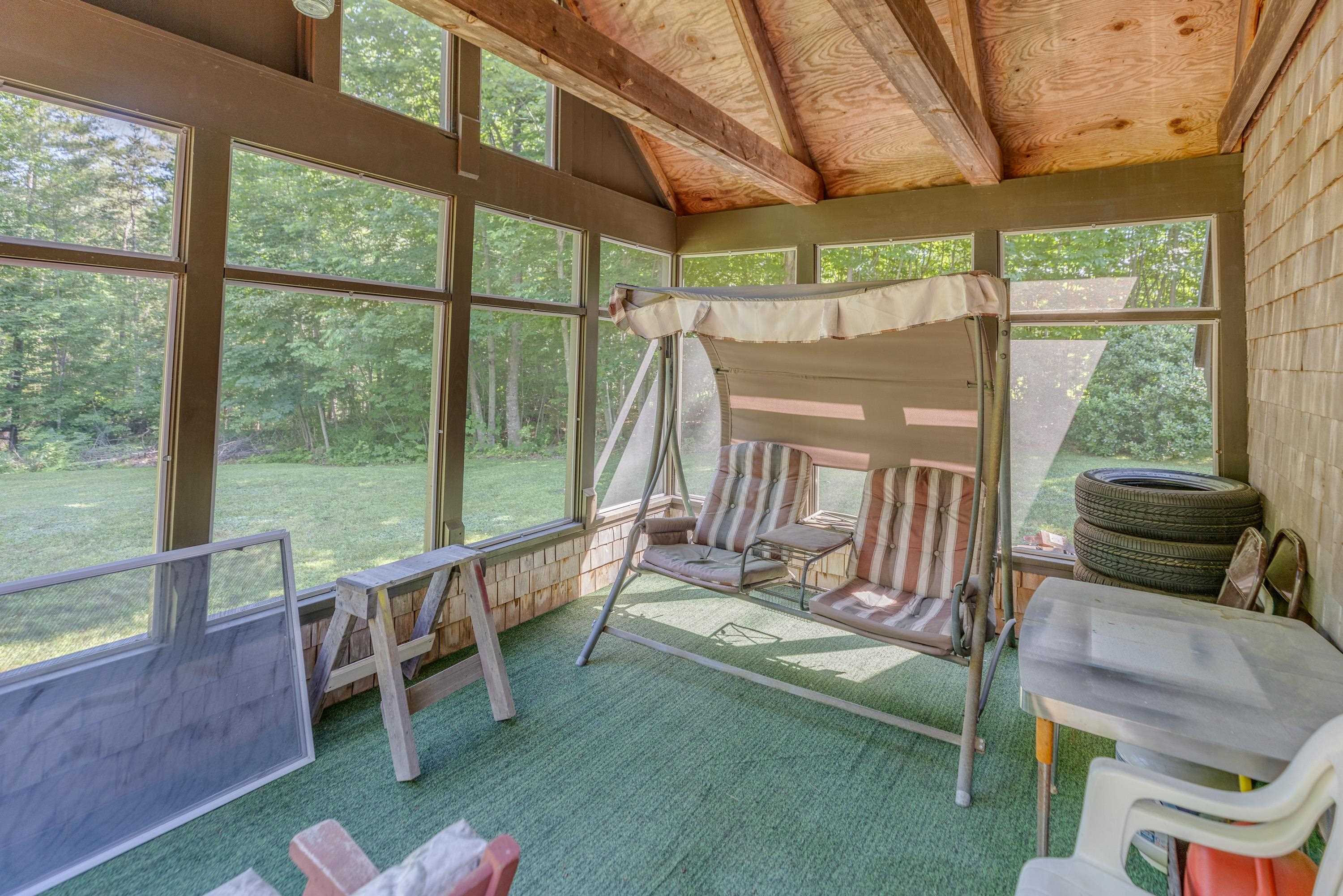 Screened in porch off the back of the house