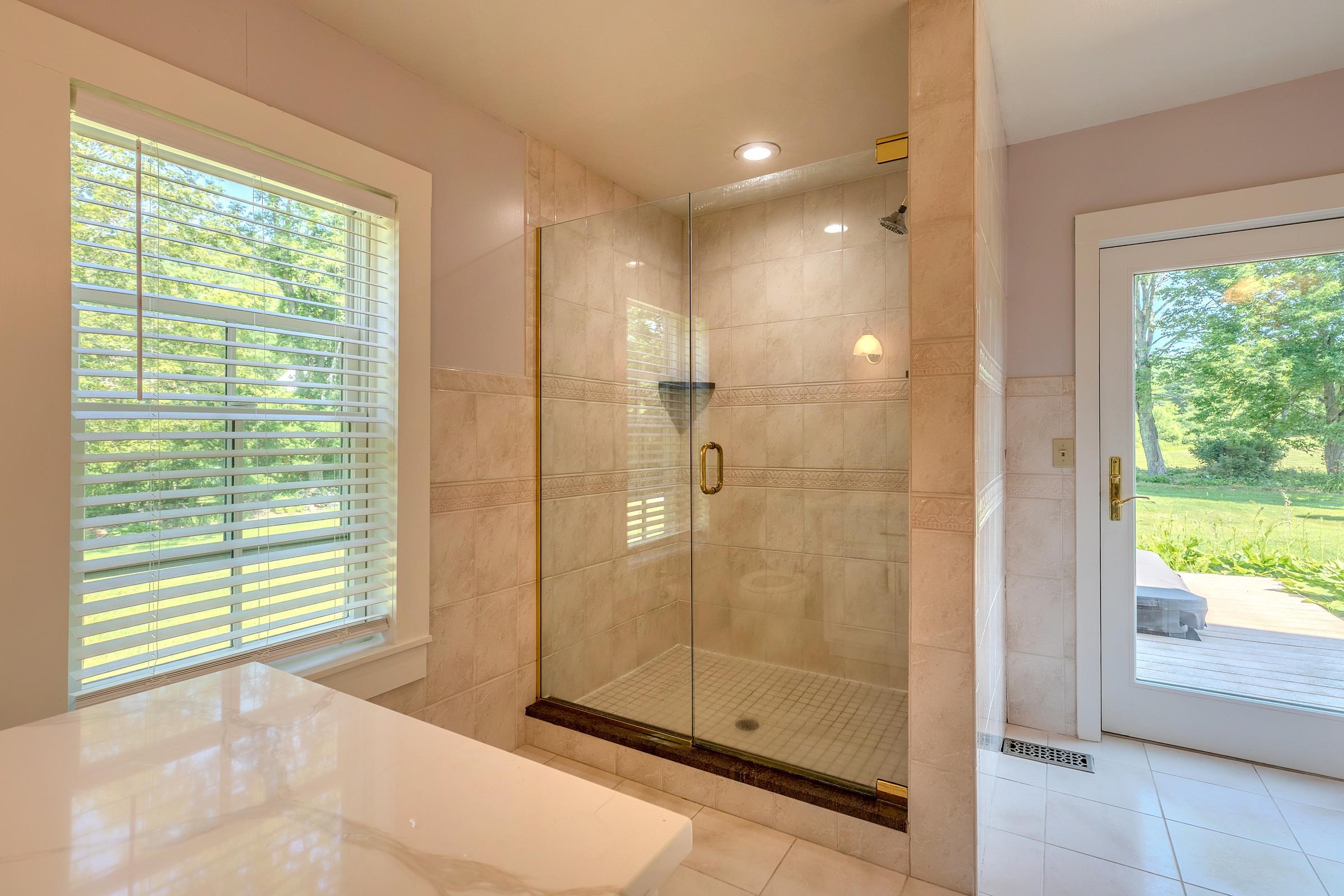 Primary bathroom with access to back deck 25755064