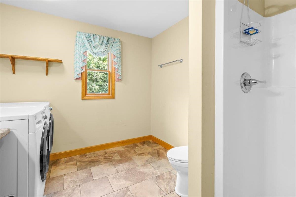 Full bath opposite laundry set up