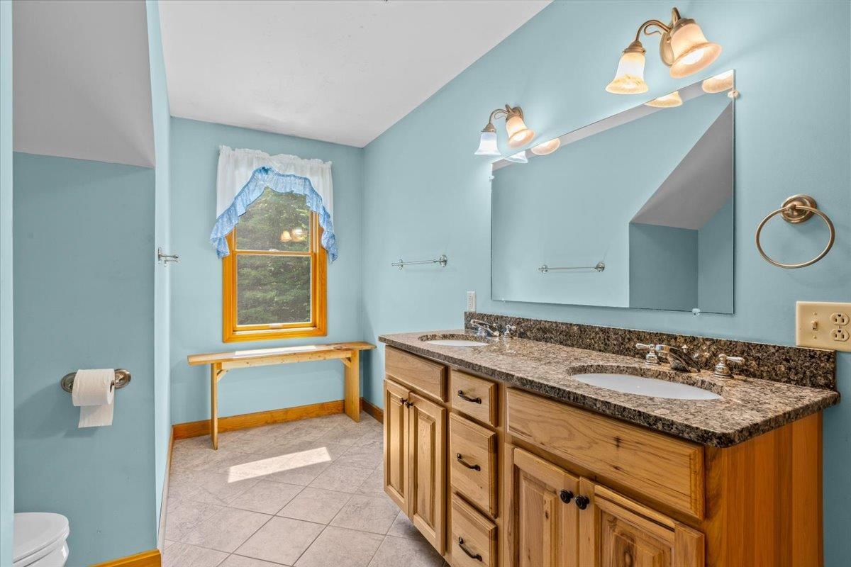 Full Bathroom with ceramic tile & granite vanity top