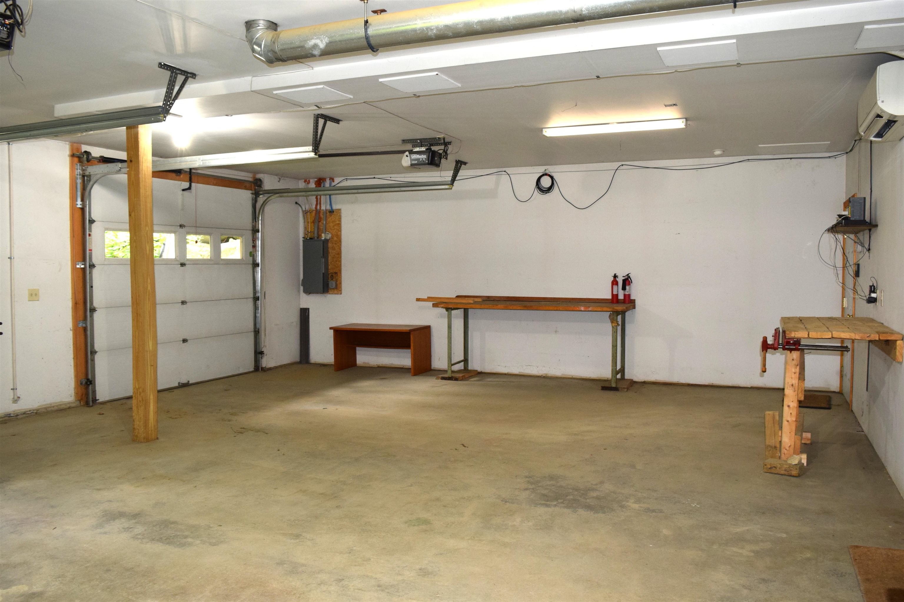Interior storage, work benches in this heated garage