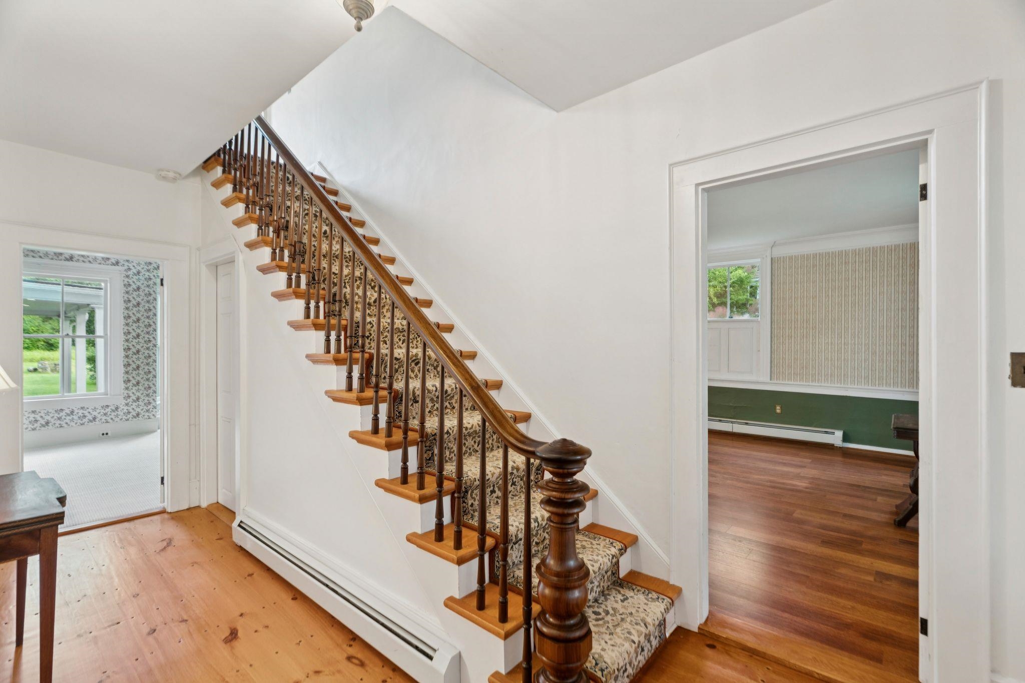 Front entryway - Den to the right, music room to the left, sunny living room at the back.