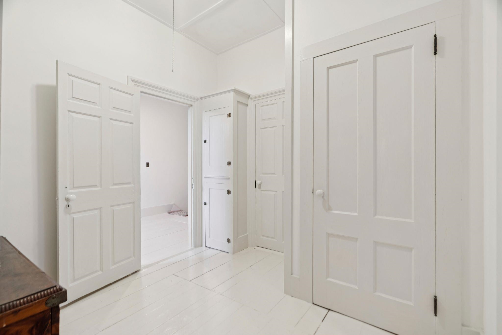 Back hall to full bath and 4th bedroom