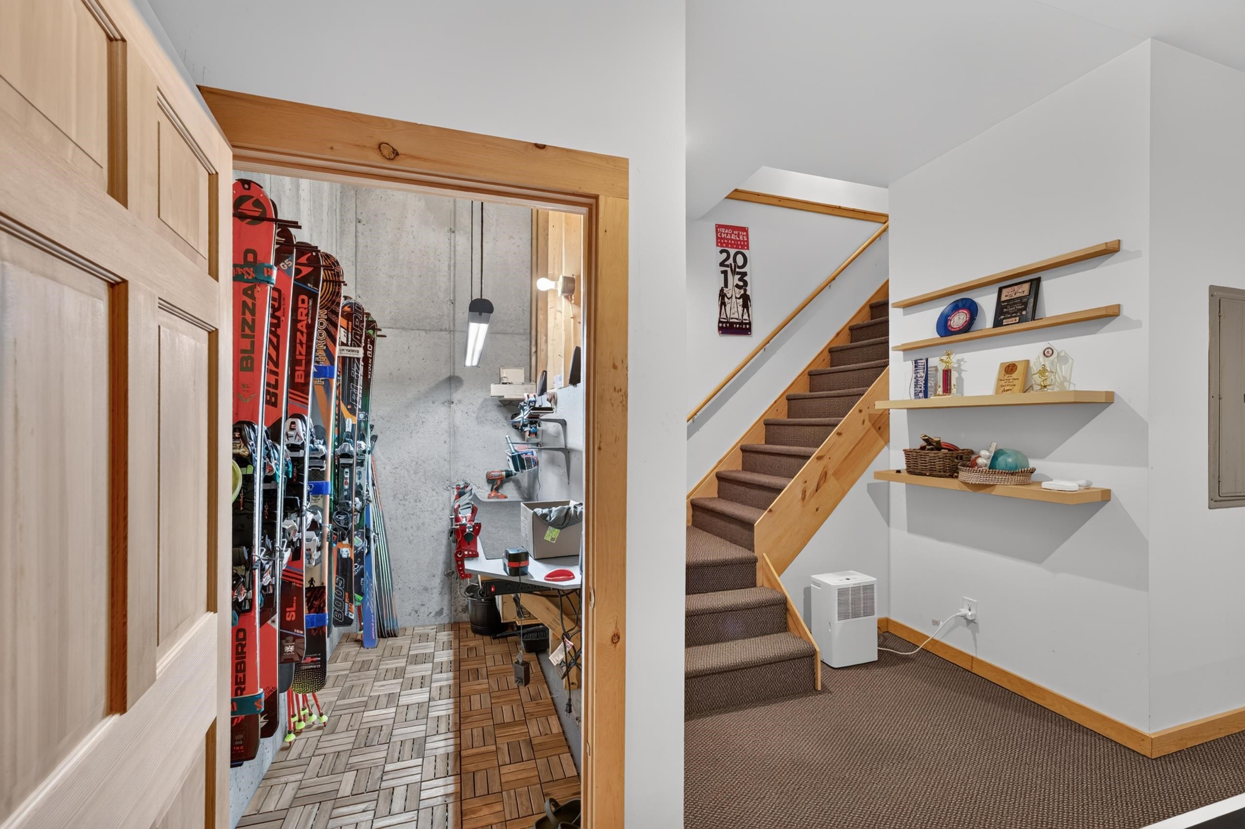 Lower Level Looking To Stairs And Ski Tuning Room