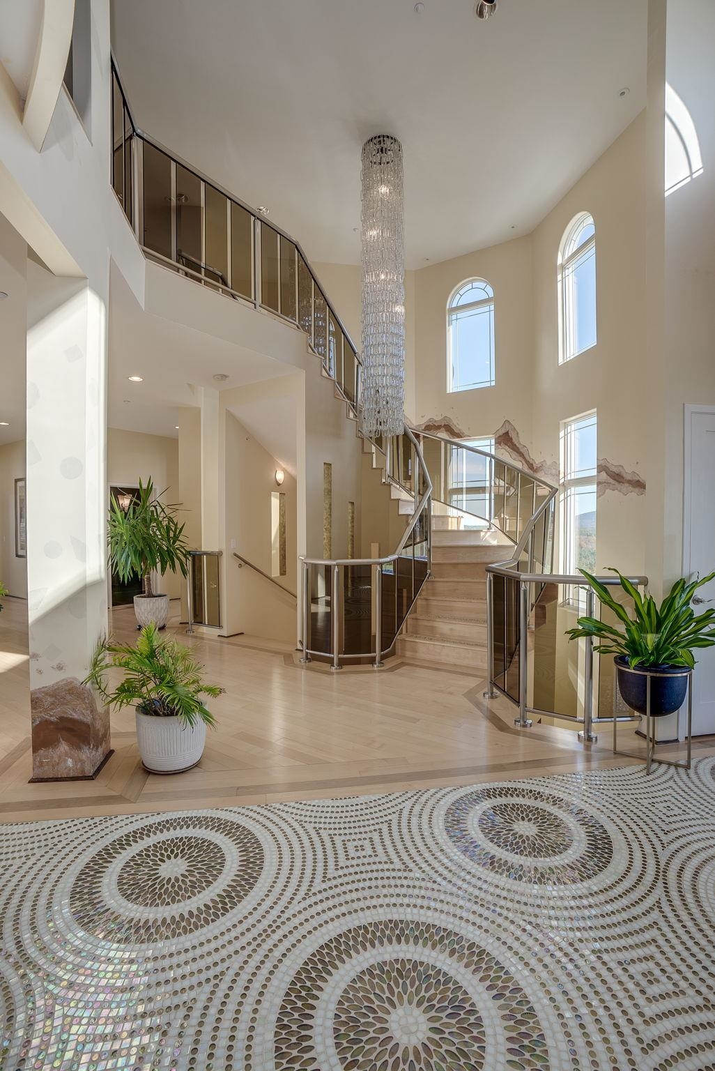 Automated Chandelier Highlights Winding Staircase