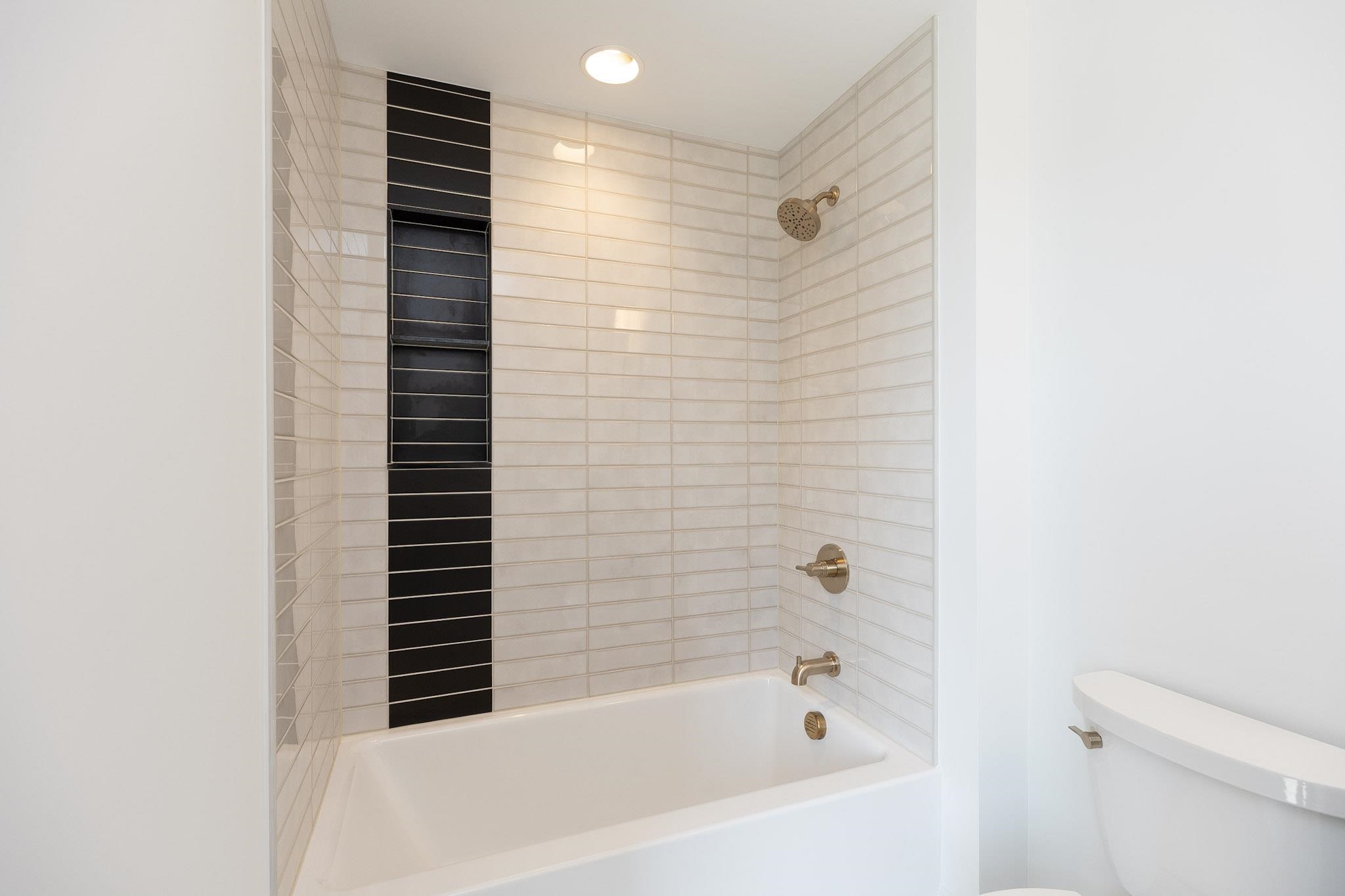 A beautifully tiled shower completes this bathroom!